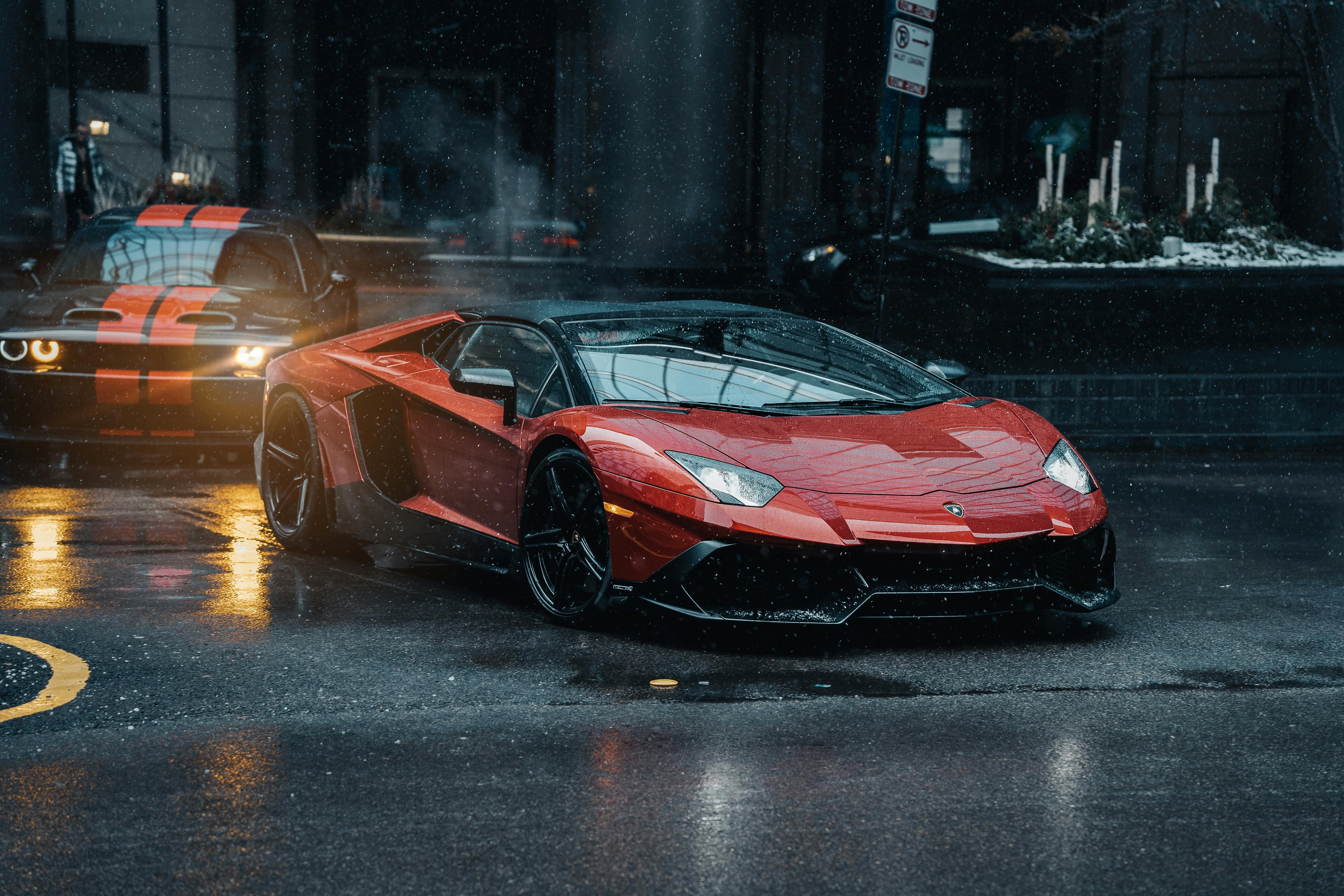 6000x4000 A Lamborghini Aventador and Dodge Challenger on the Street in Rain · Free