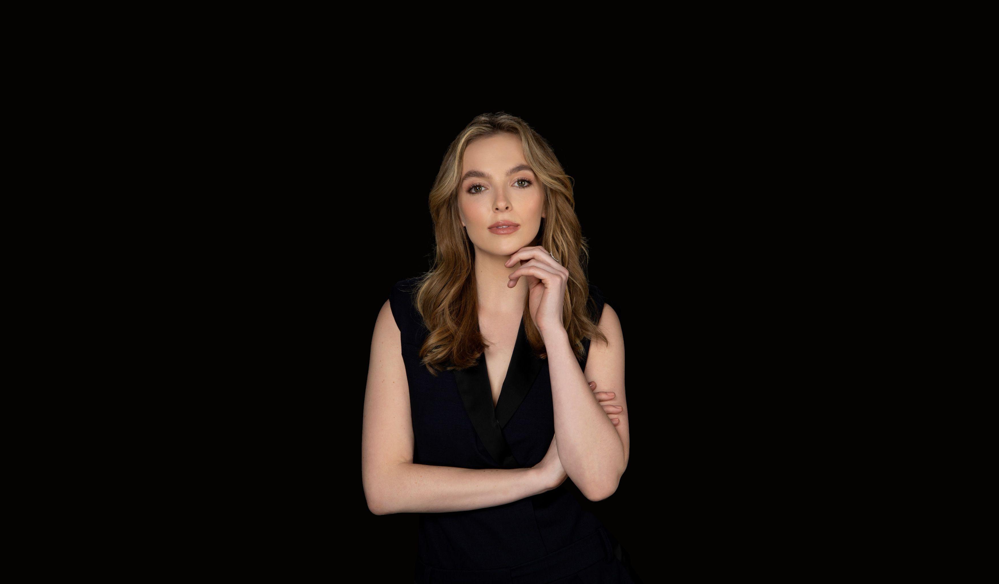 Jodie Comer posing for a photoshoot