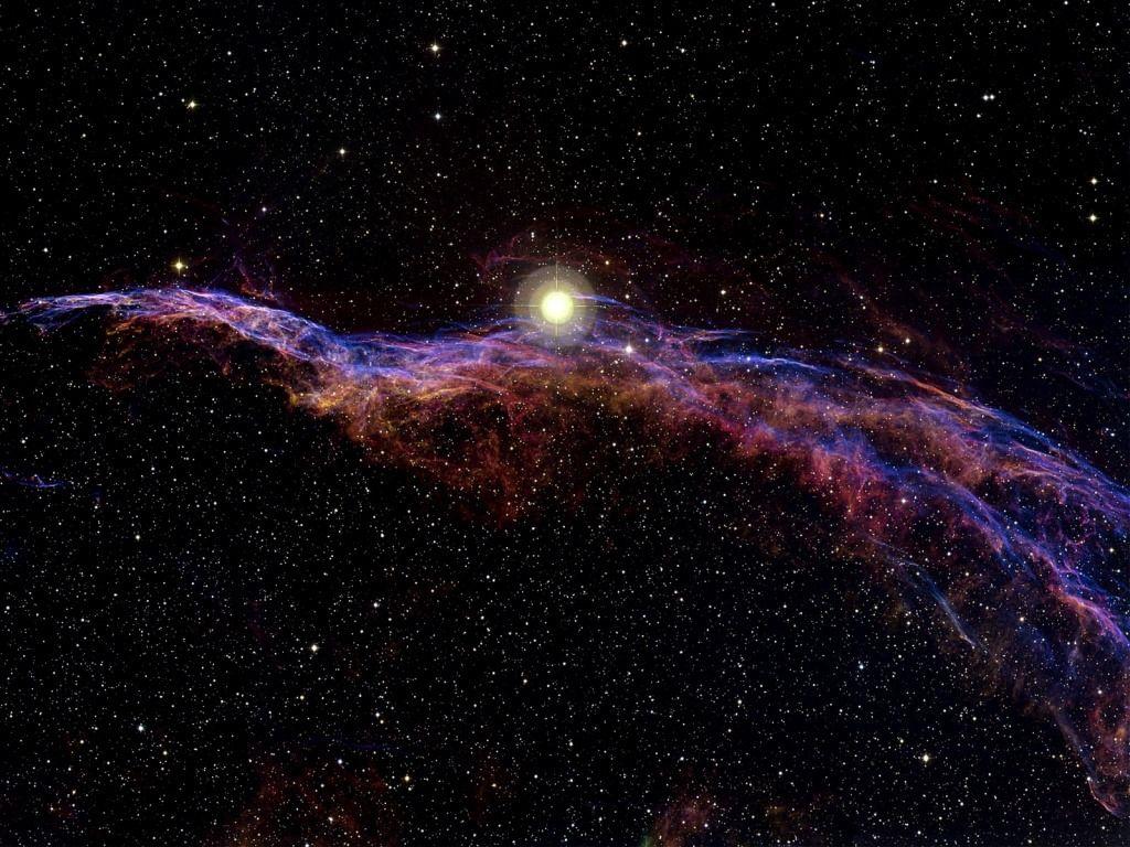 1024x768 The Veil Nebula is a cloud of heated and ionized gas and dust in