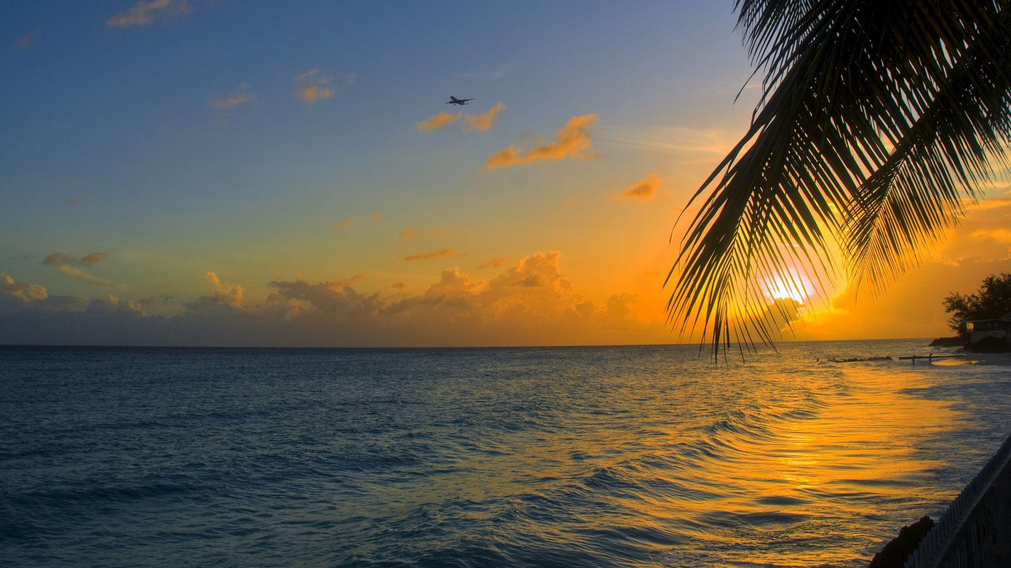 2048x1152 Download wallpaper 2048x1152 ocean, sunset, palm, beach, barbados
