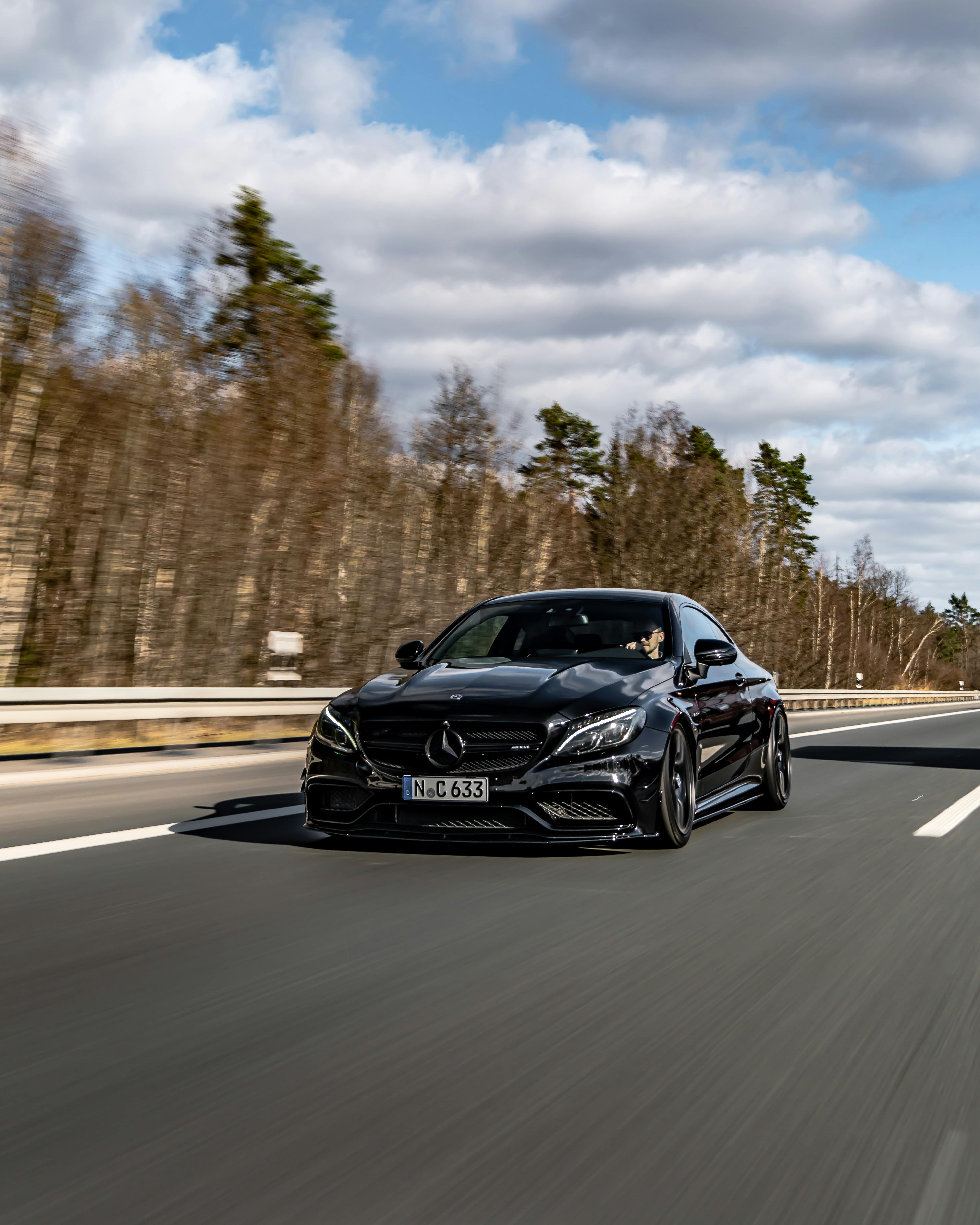 4000x5000 A Black Mercedes Benz C Class on a Road · Free