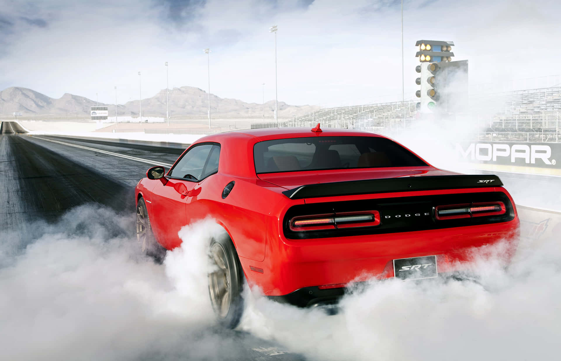 1920x1237 Download Dodge Challenger Srt Red Car Driving Down A Track Wallpaper