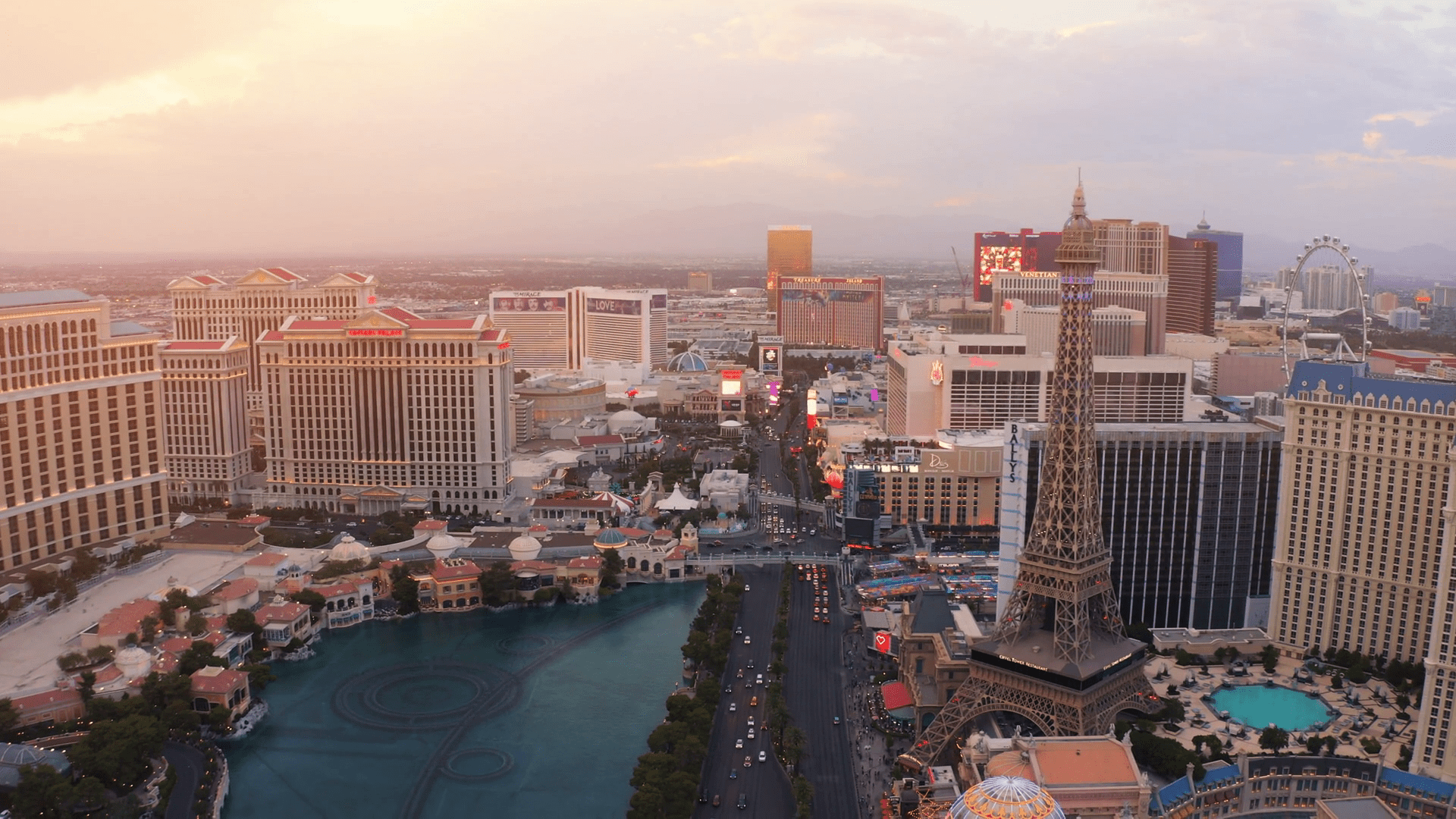 1920x1080 Breathtaking view of Las Vegas skyline during sunset with vibrant lights illuminating the strip