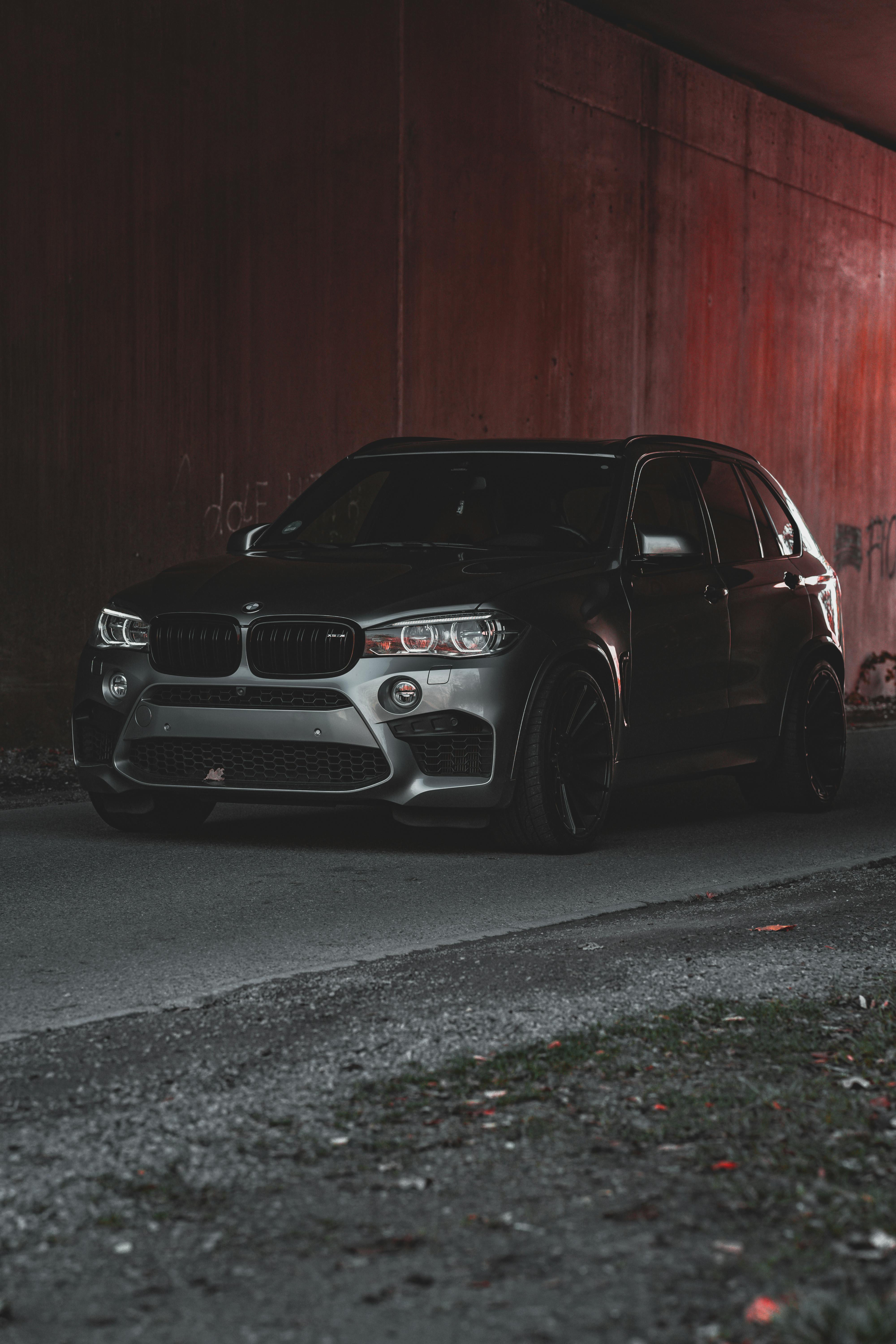 4000x6000 A Gray BMW X5 Parked by a Red Wall · Free
