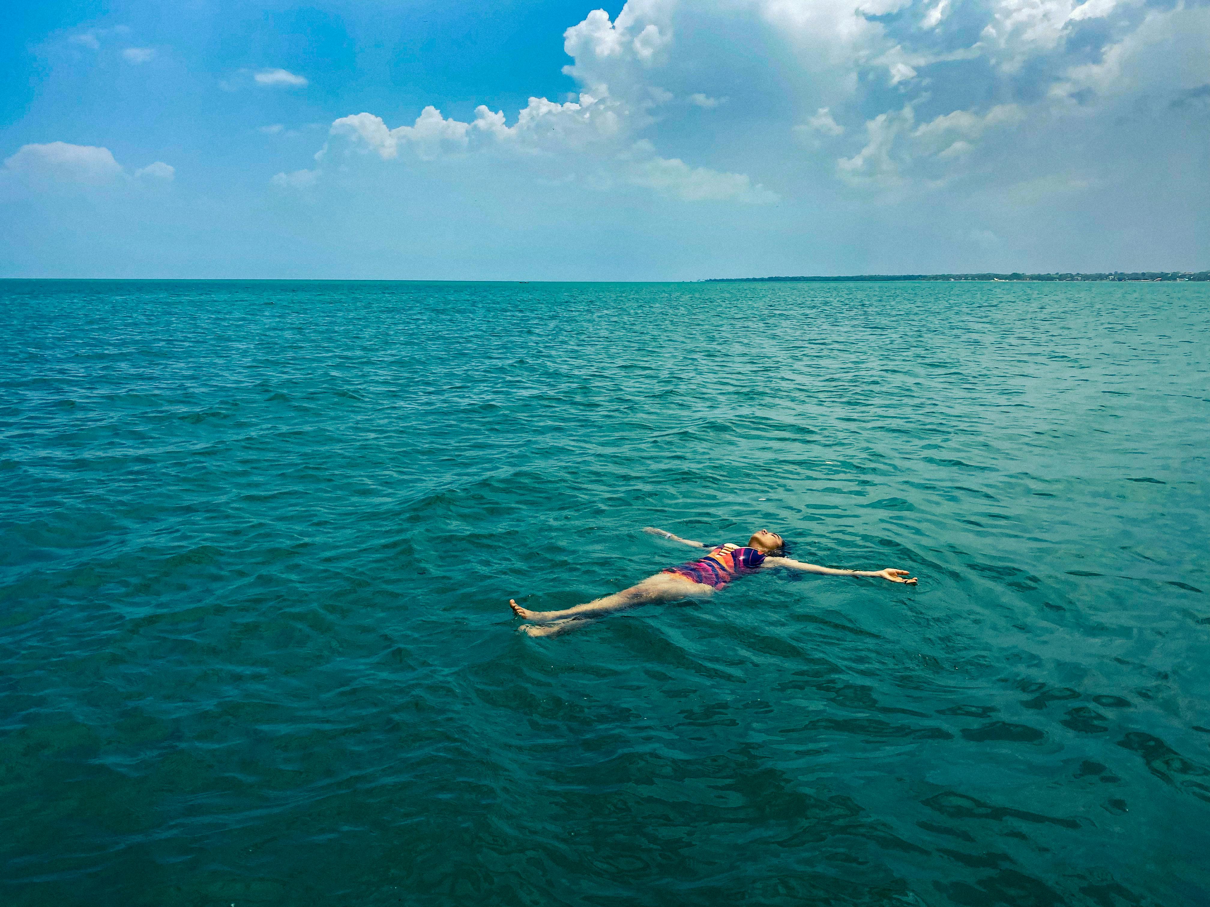 4032x3024 Woman Lying Down on Sea Water · Free