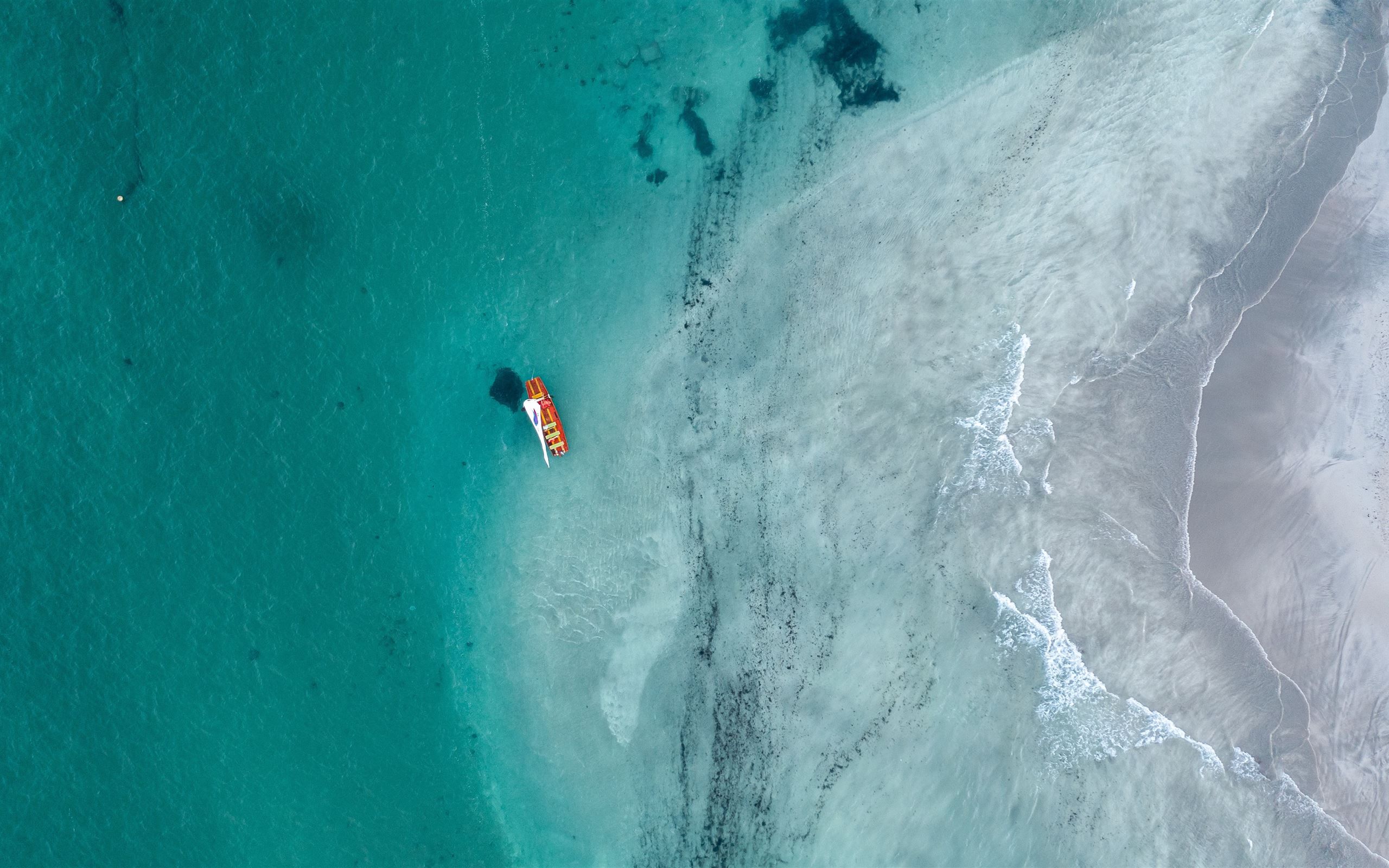 2560x1600 boat floating on body of water during day MacBook Air Wallpaper Download
