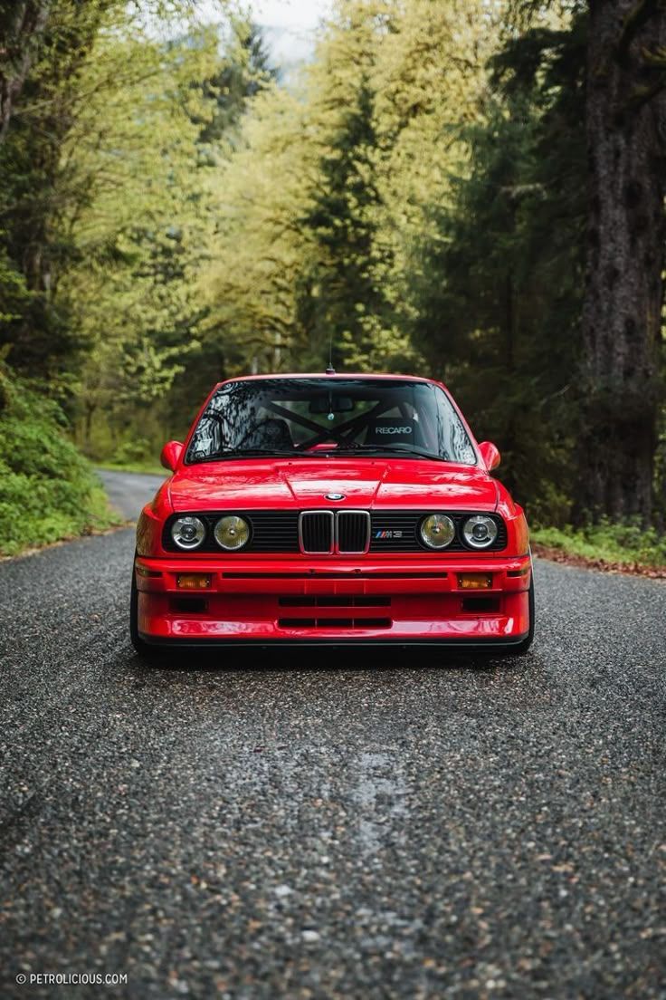 736x1104 Red BMW E30 M3 Parked on the Side of the Road