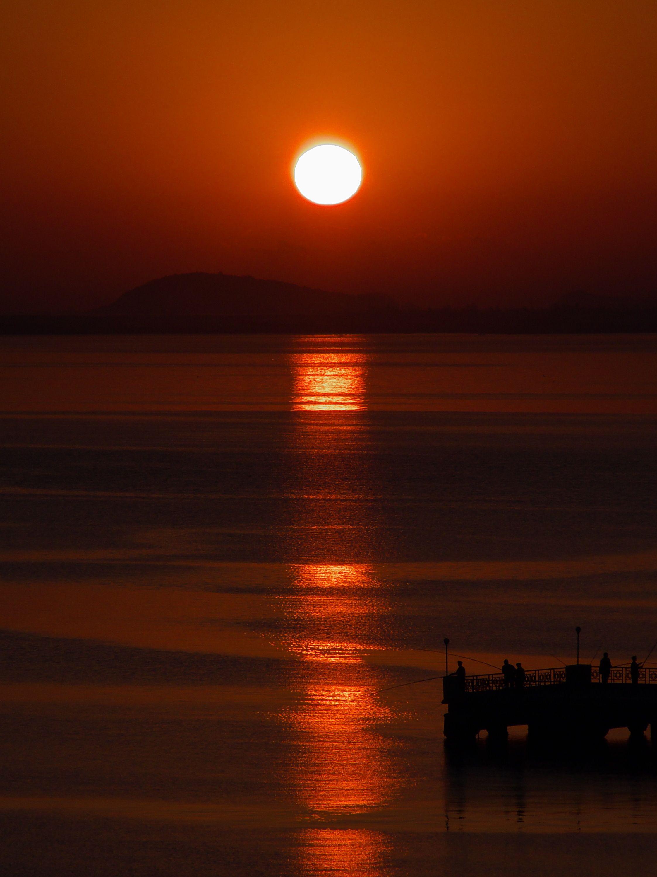 2245x2994 Download wallpaper 2245x2994 sunrise, sun, silhouettes, fishermen