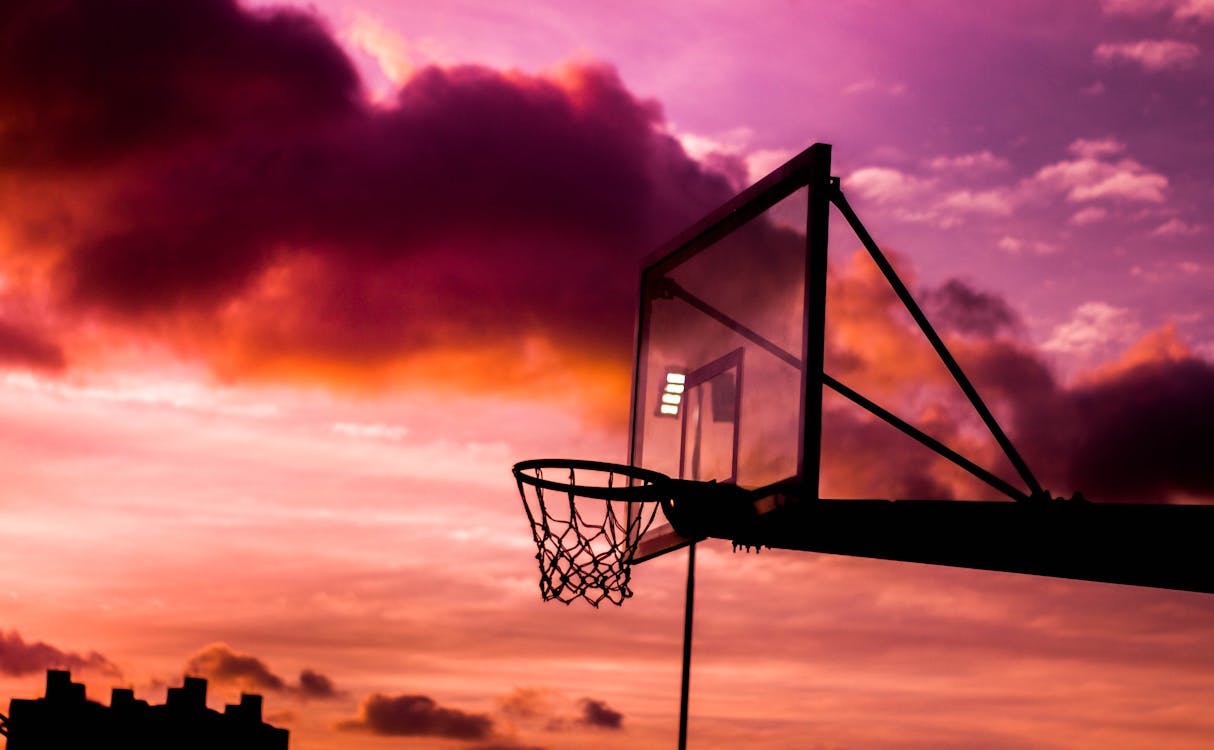1214x750 Silhouette Photo of Basketball Hoop During Golden Hour · Free