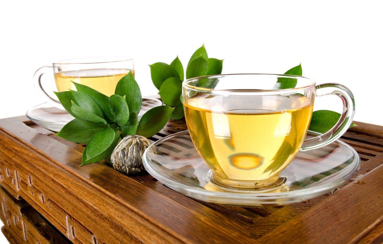 1332x850 Wallpaper leaves, green, tea, Cup, white background, drink, table