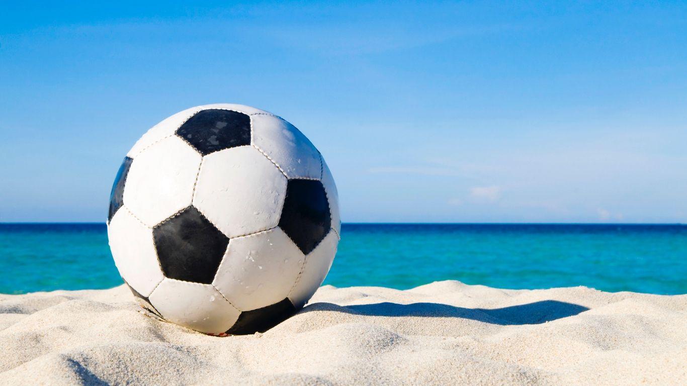 1366x768 Download wallpaper 1366x768 soccer ball, football, sand tablet
