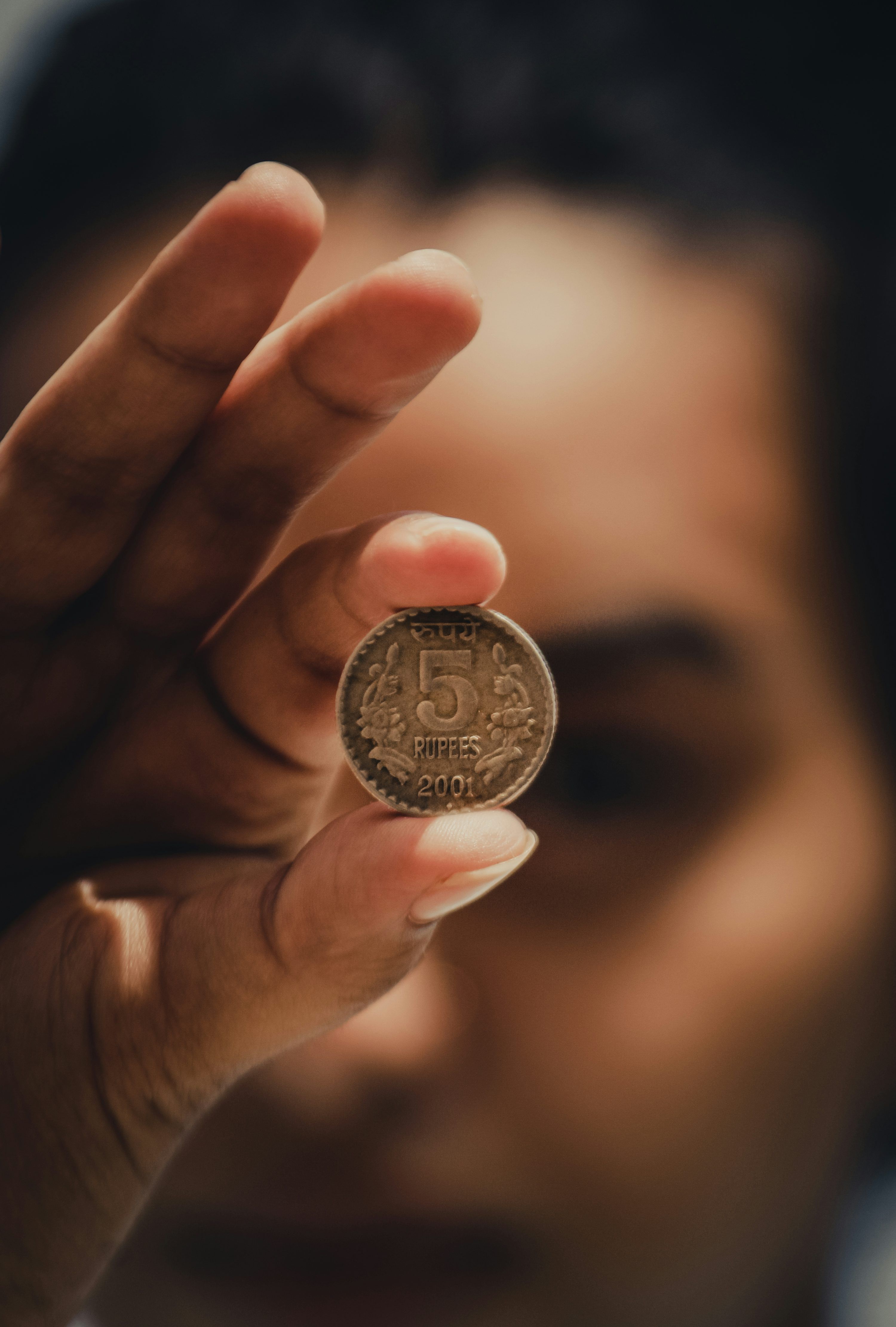 3000x4442 Person holding silver round coin photo