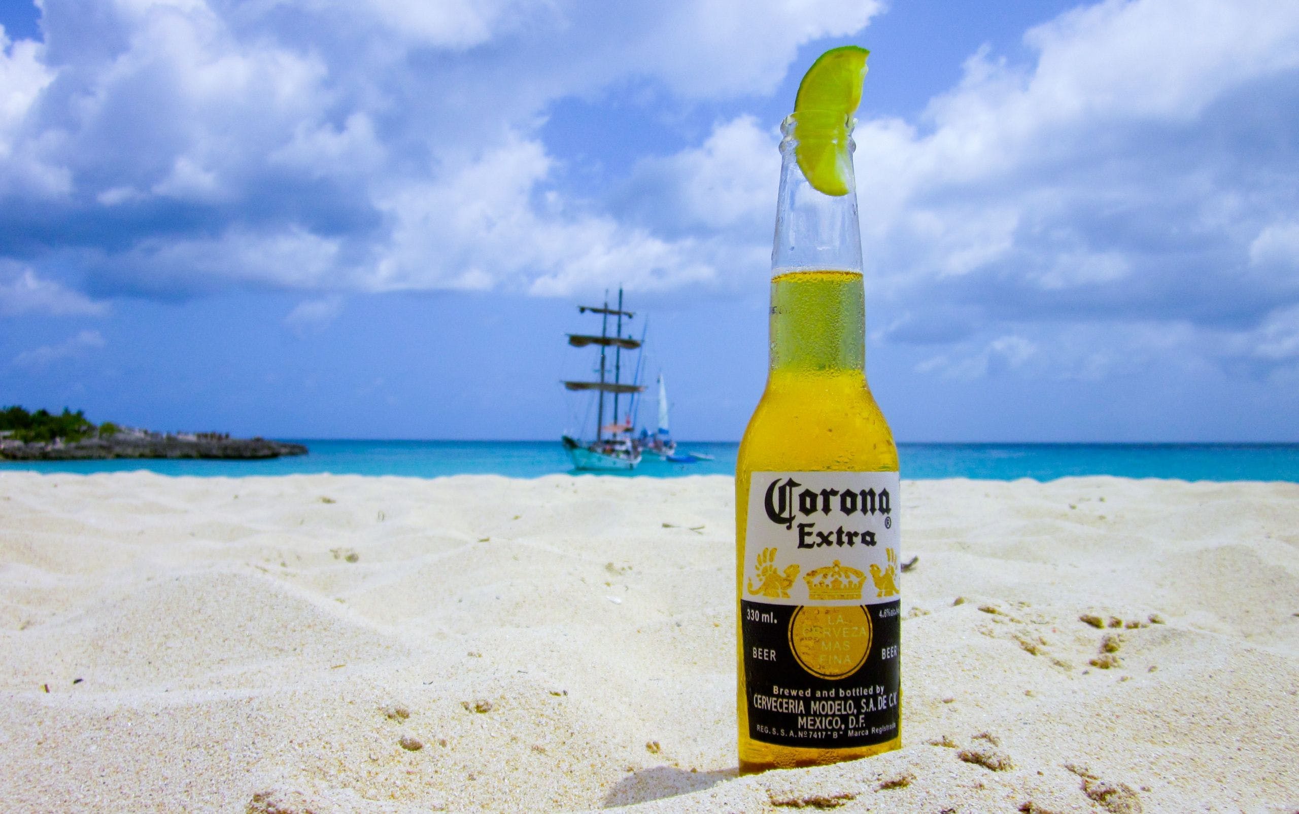 2560x1605 HD Corona Beer Beach Sand Wallpaper