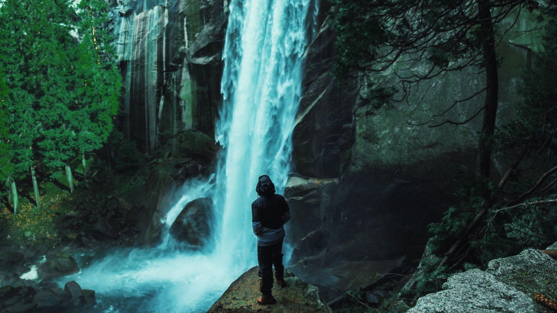 1920x1080 Man Looking Mountain Waterfall Wallpaper