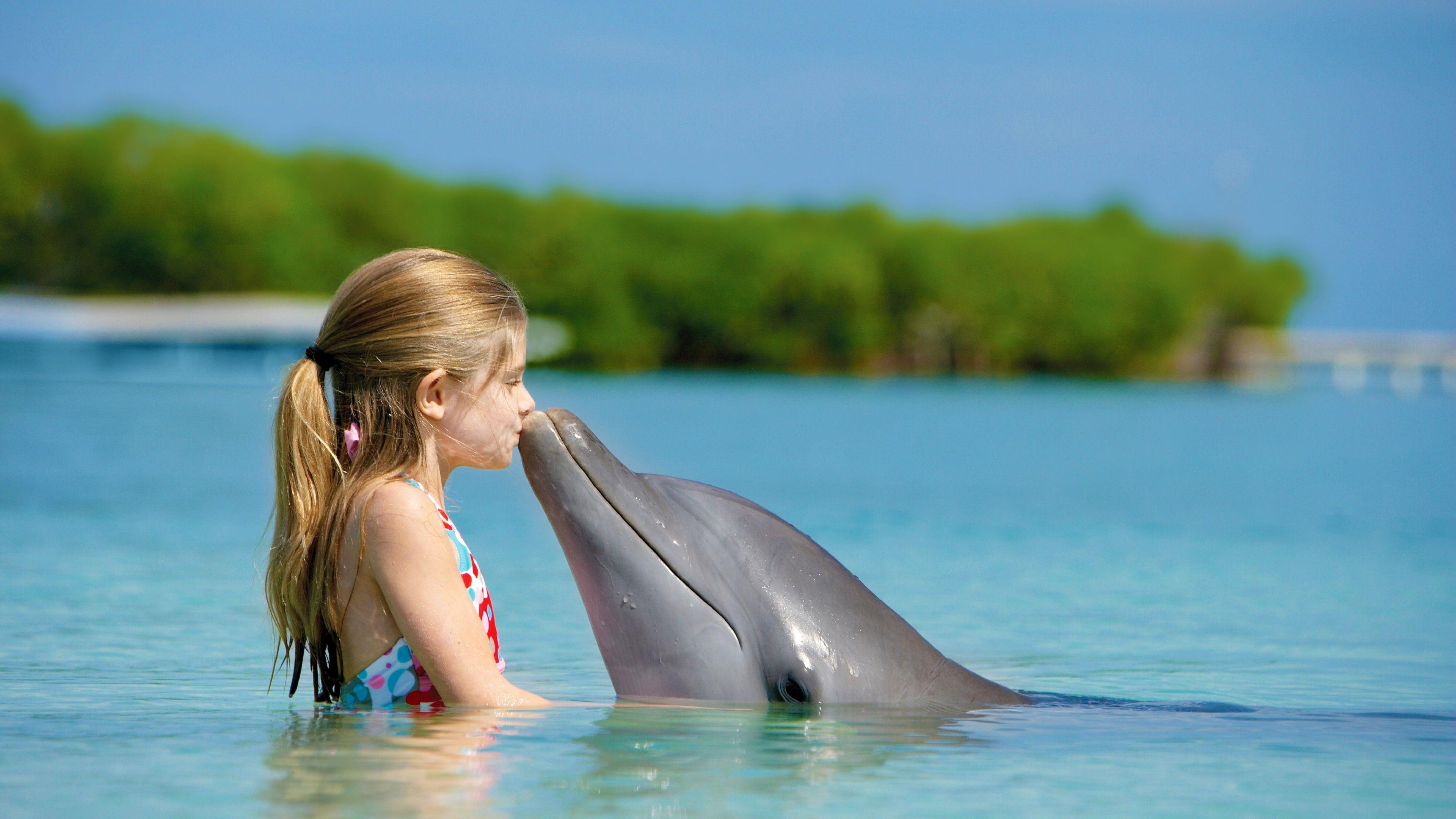 3840x2160 Wallpaper Girl and dolphin, ocean, Maldives, Travel