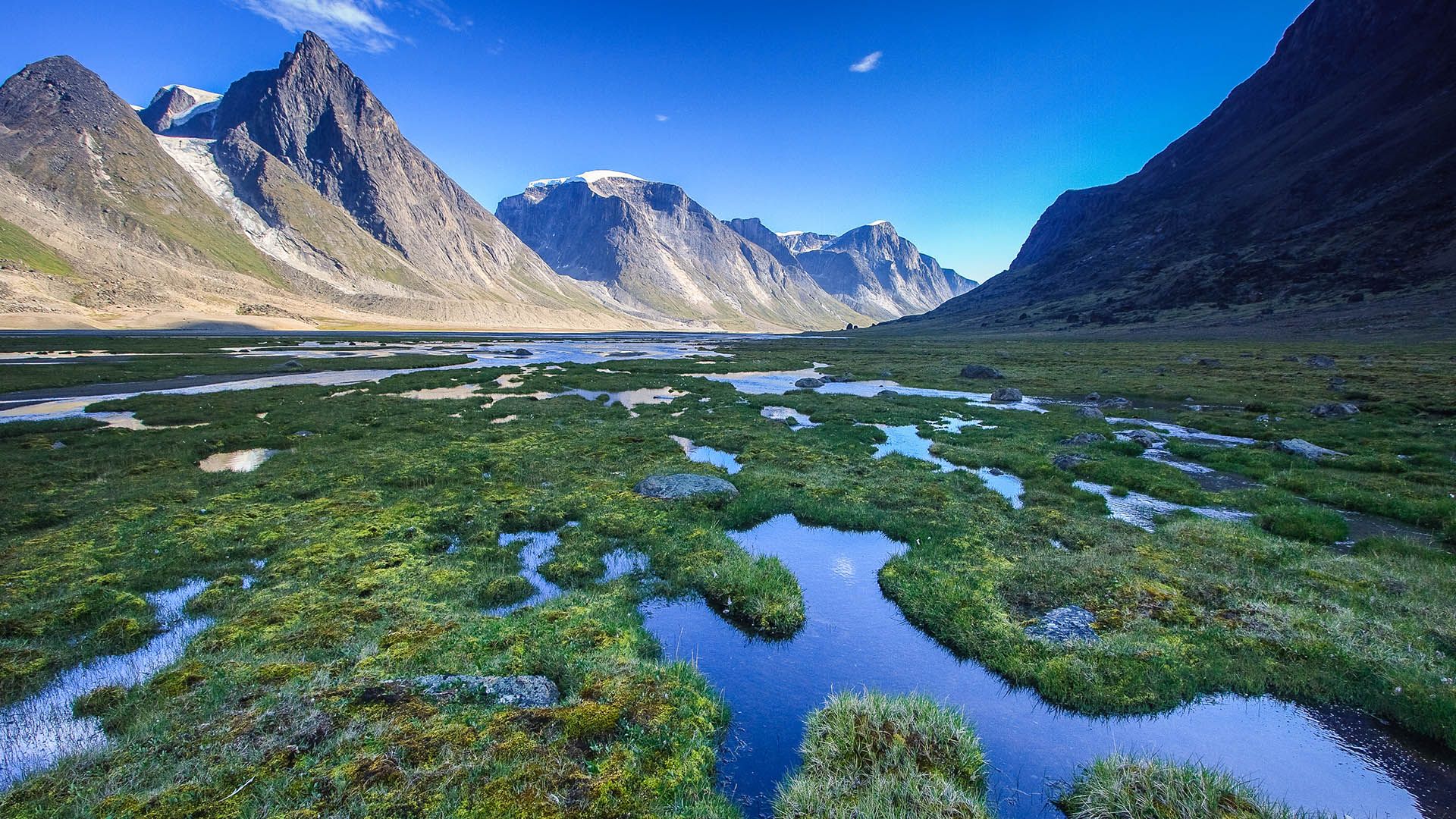 1920x1080 Marshy landscape along the trail in Akshayuk Pass, Baffin Island, Nunavut, Canada. Windows Spotlight Image