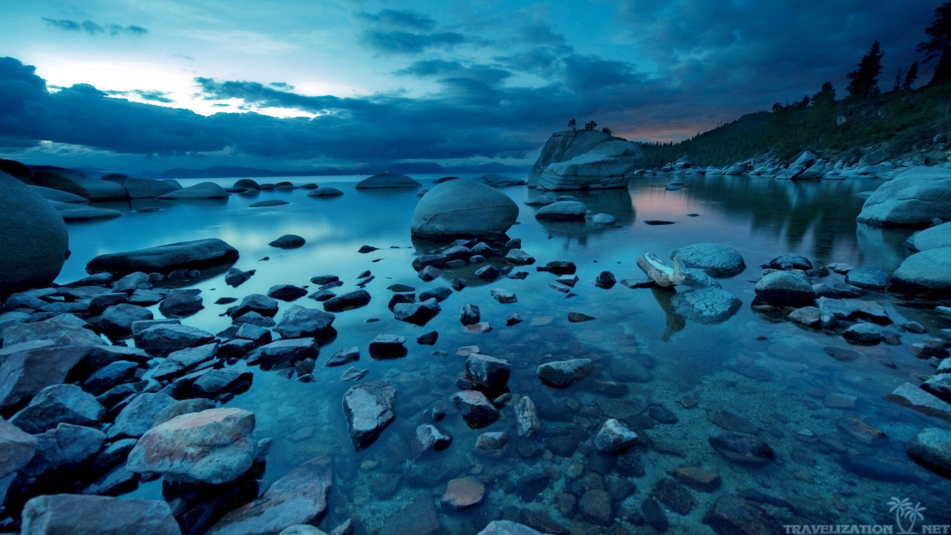 1920x1080 Serene River Rocks: Stunning HD Nature Wallpaper