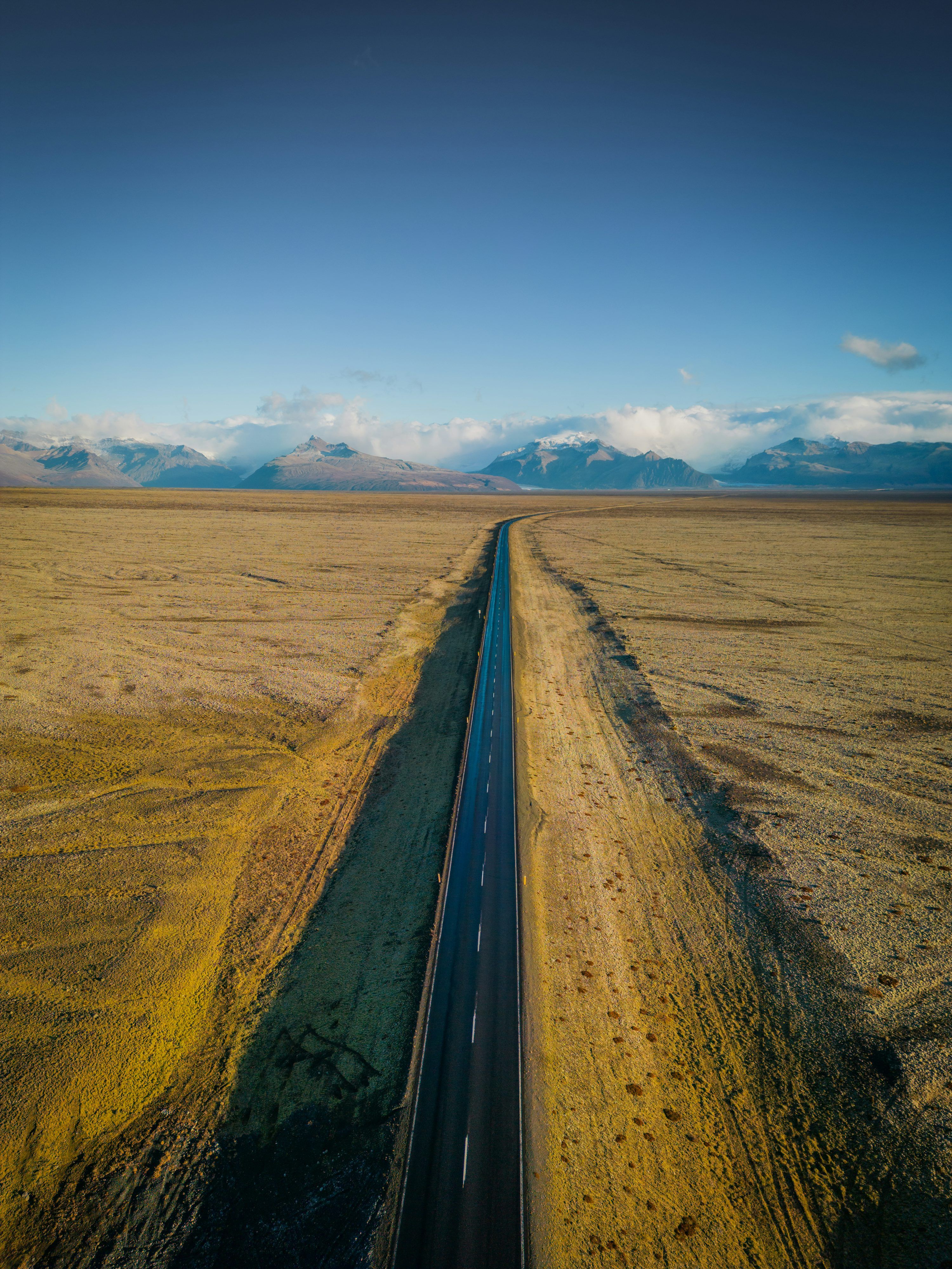 3000x4000 An aerial view of a road in the middle of nowhere photo