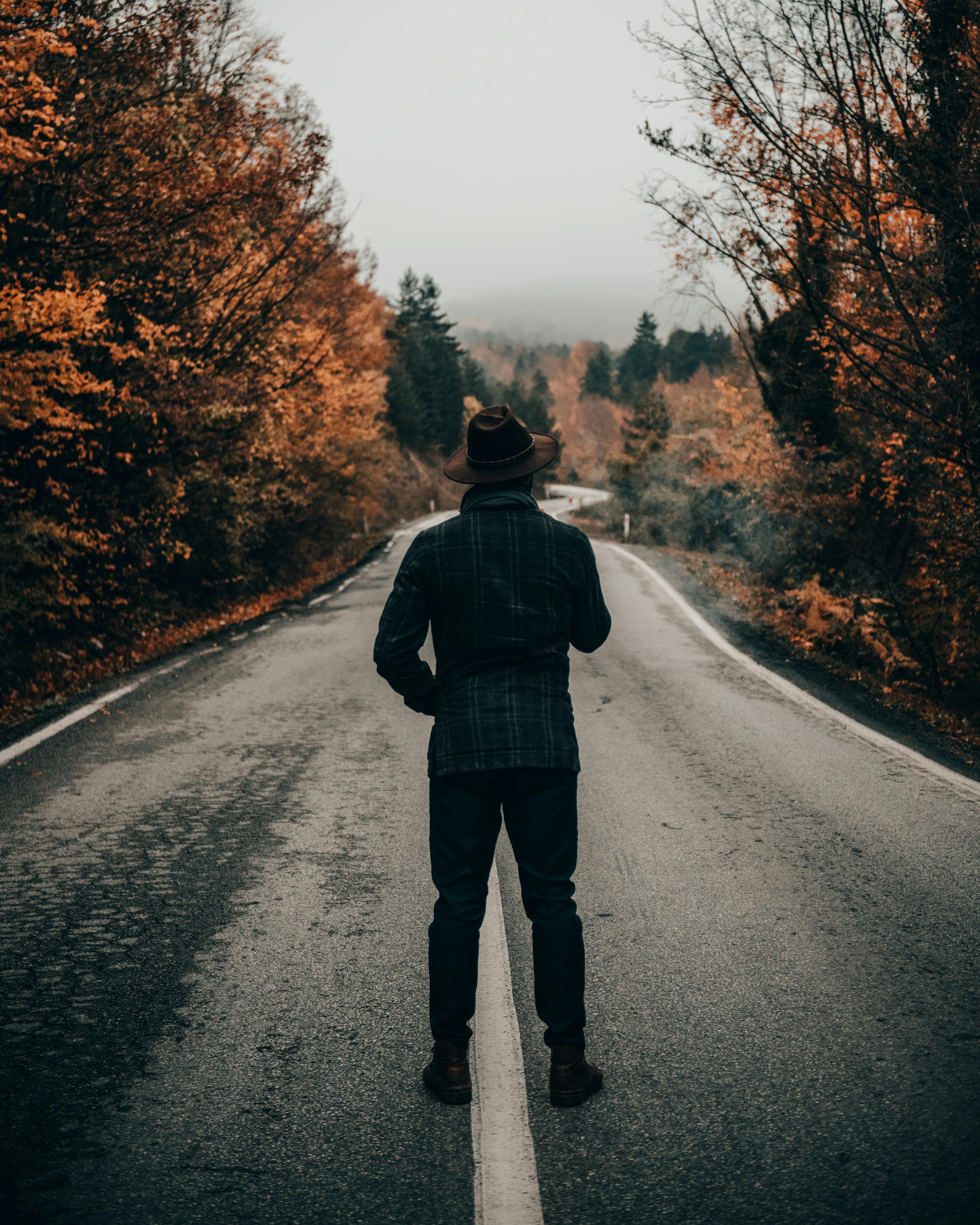 4912x6140 Man Standing on an Asphalt Road in the Middle of Nowhere · Free
