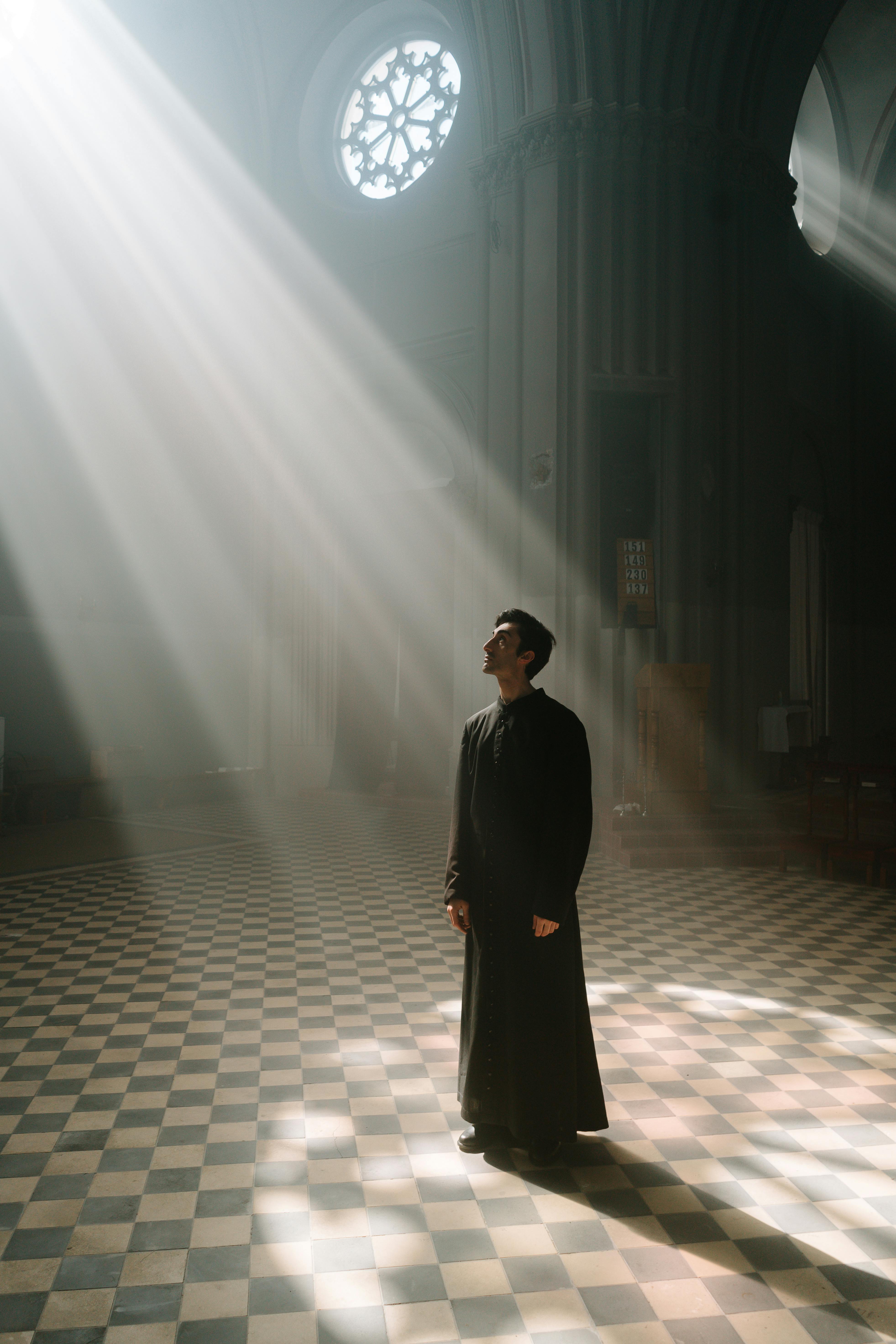 3926x5889 Man in Black Cassock Standing in the Cathedral · Free