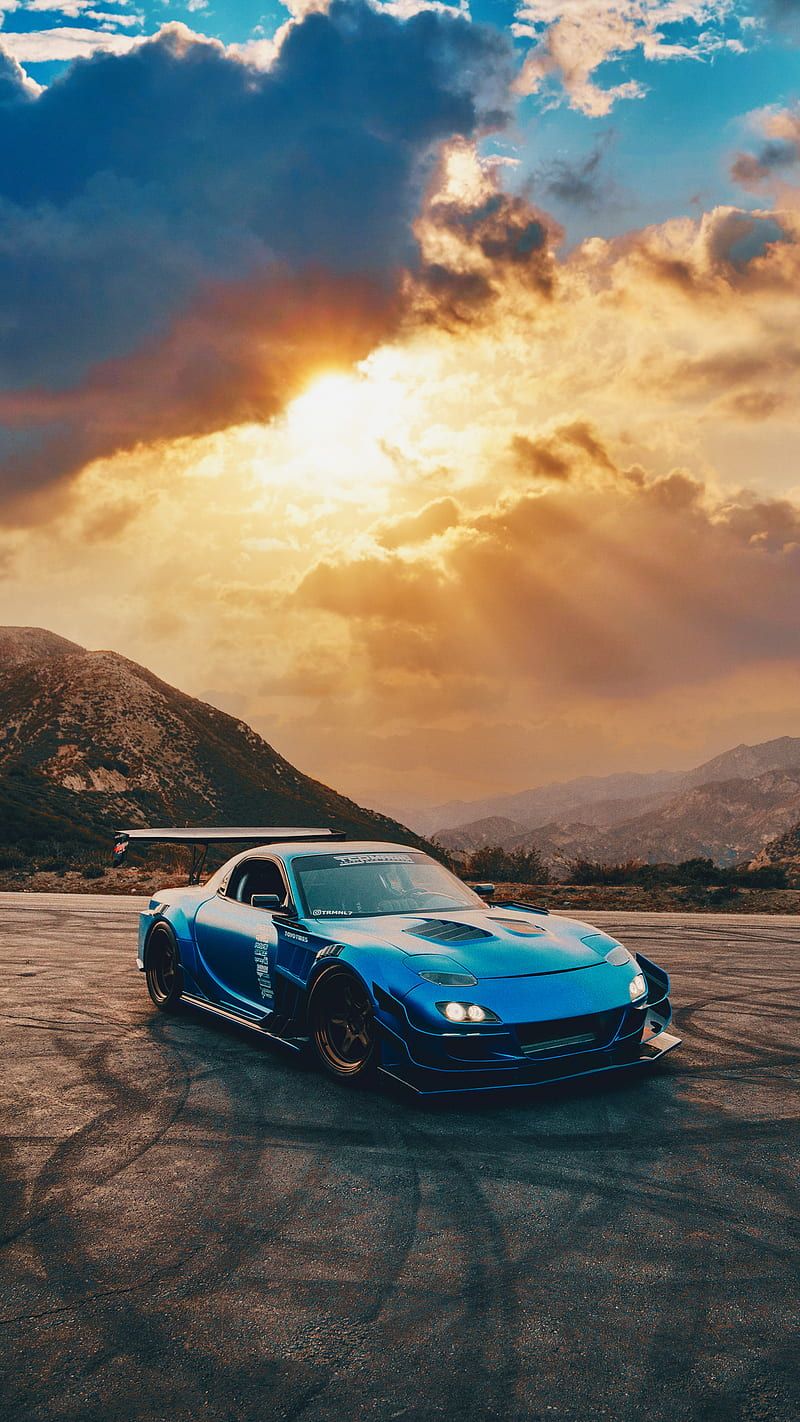 800x1422 Sunset, car, clouds, drift, exotic, hills, nature, race, sports car, sun, HD phone wallpaper