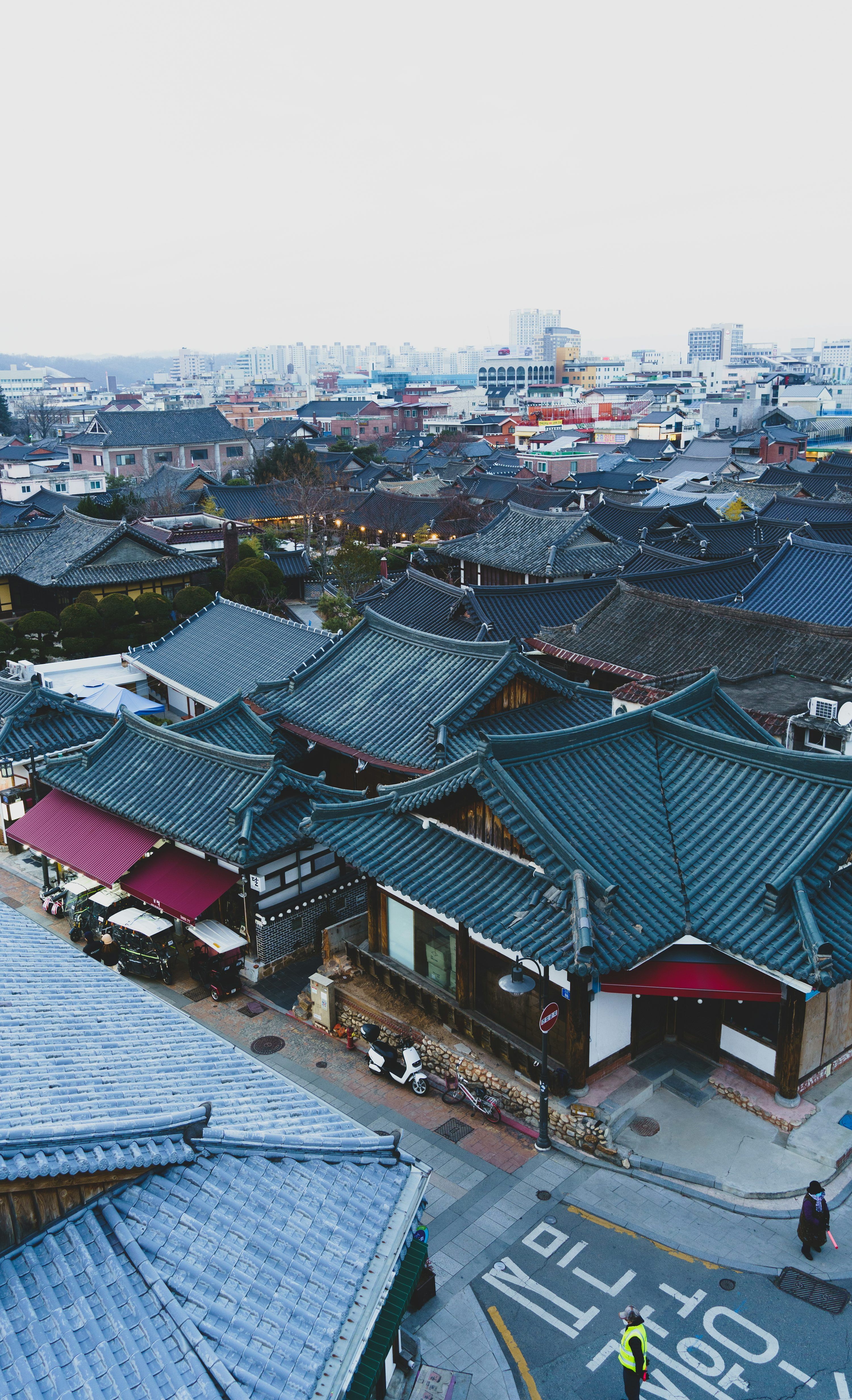 3000x4929 A group of buildings with a sky background photo
