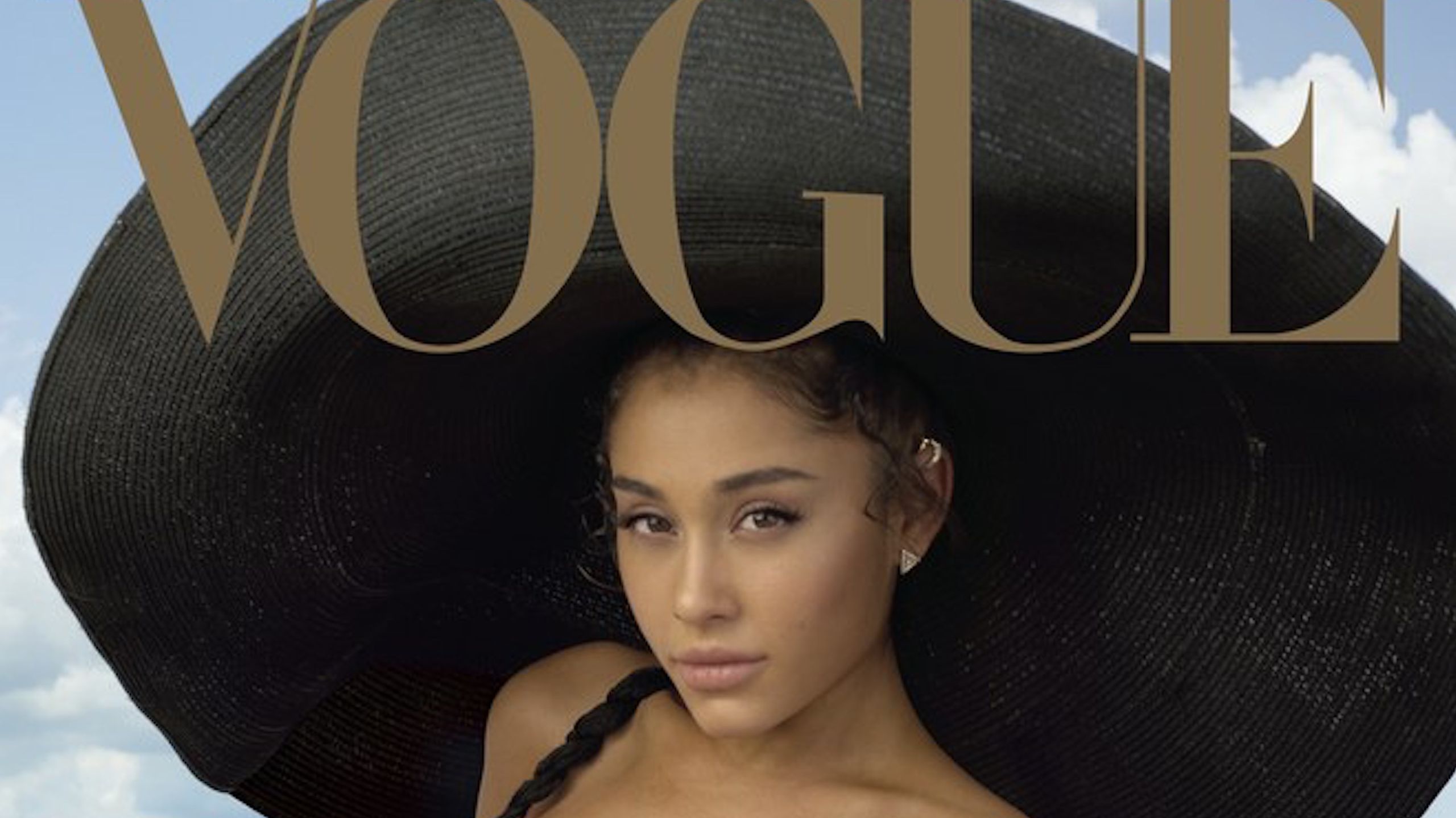 2560x1440 Ariana Grande Wears Natural Curly Hair on Vogue Cover
