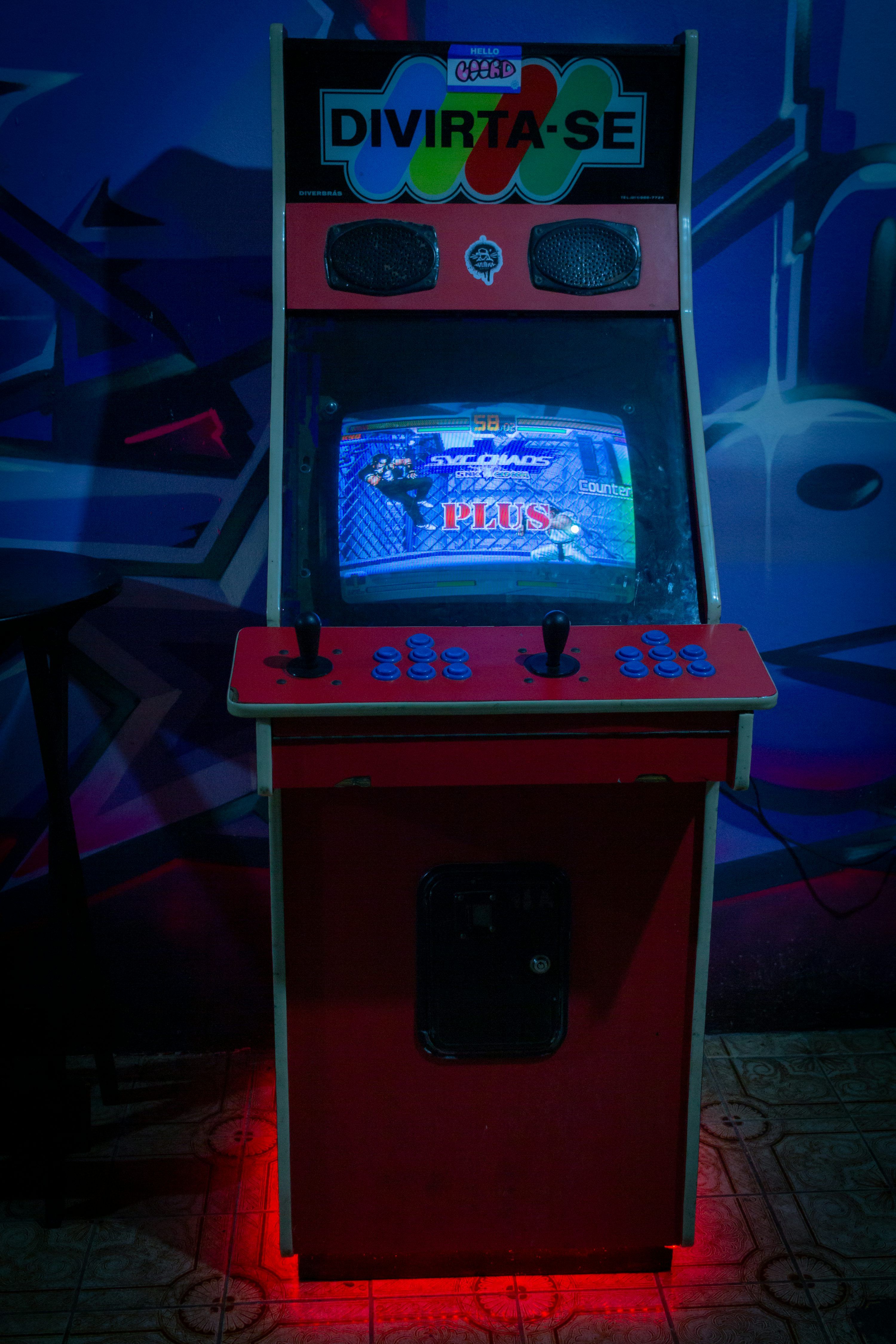 3000x4500 A video game machine sitting on top of a tile floor photo
