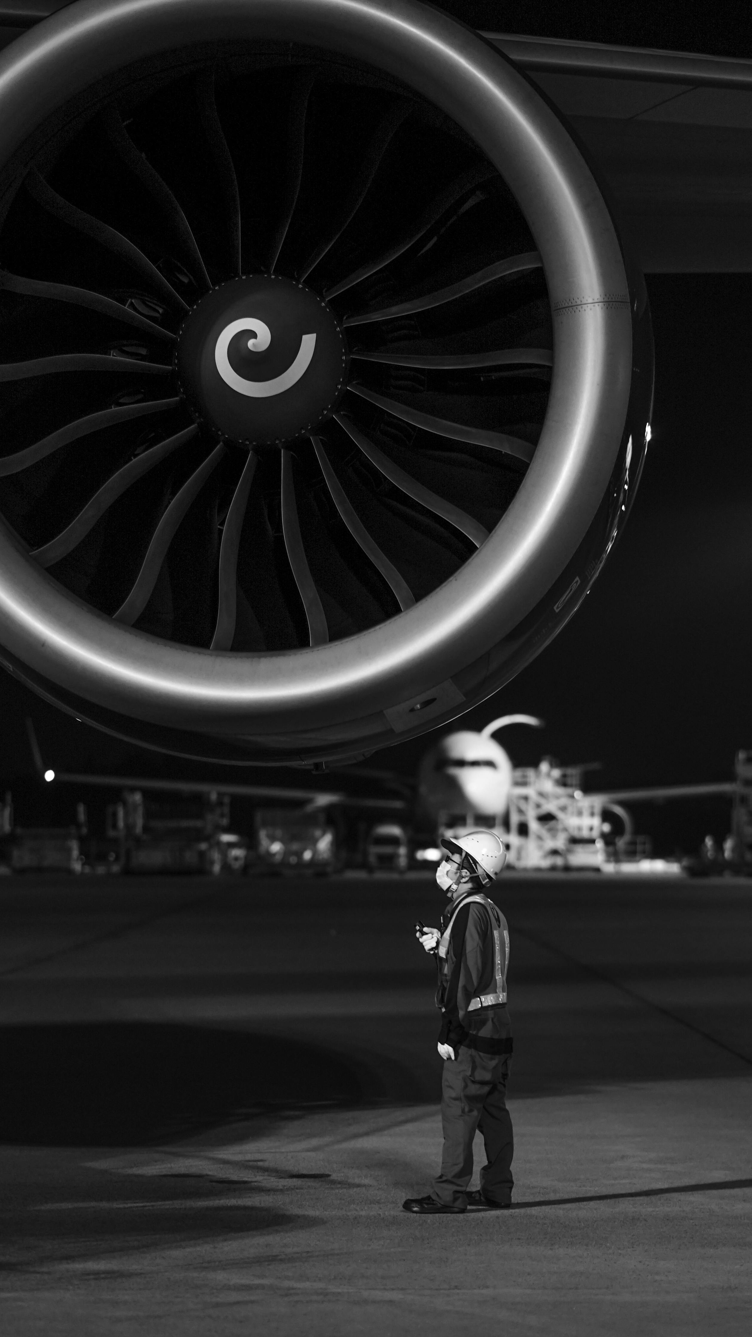 2517x4474 Close Up View of an Airplane Engine during Night Time · Free