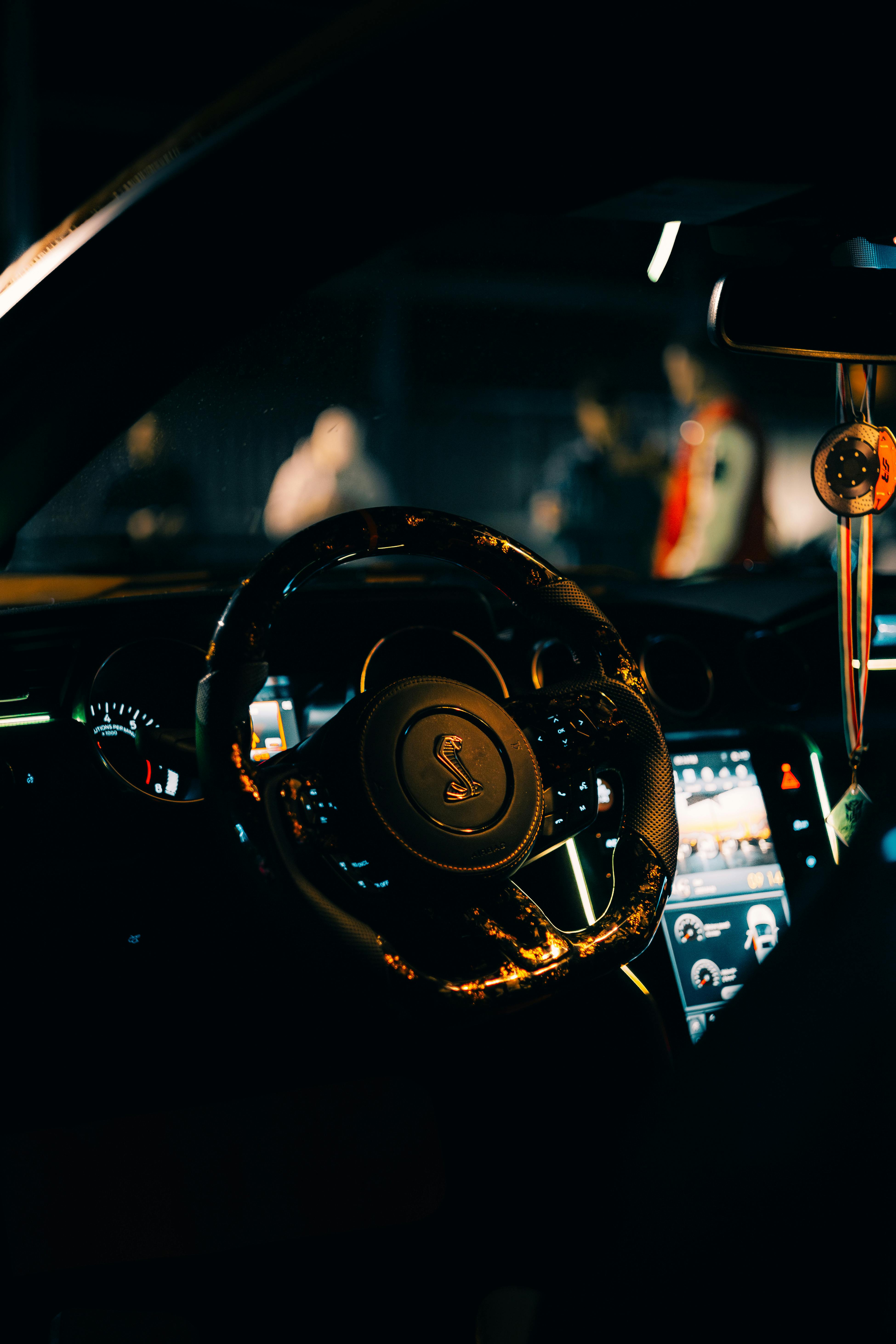 3899x5848 Luxury Car Interior at Night with Steering Wheel Focus · Free