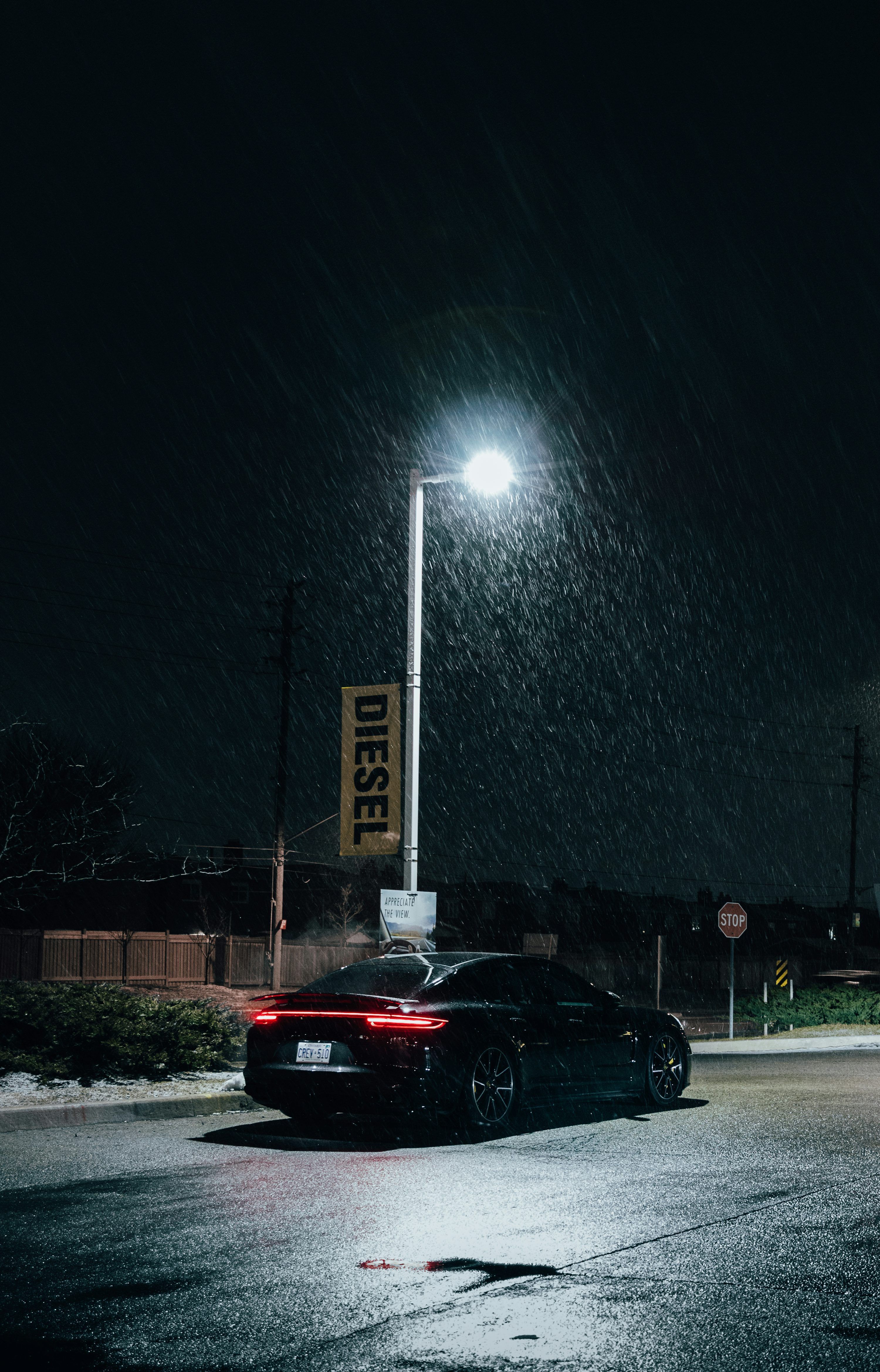 3000x4678 Black car on road during night time photo