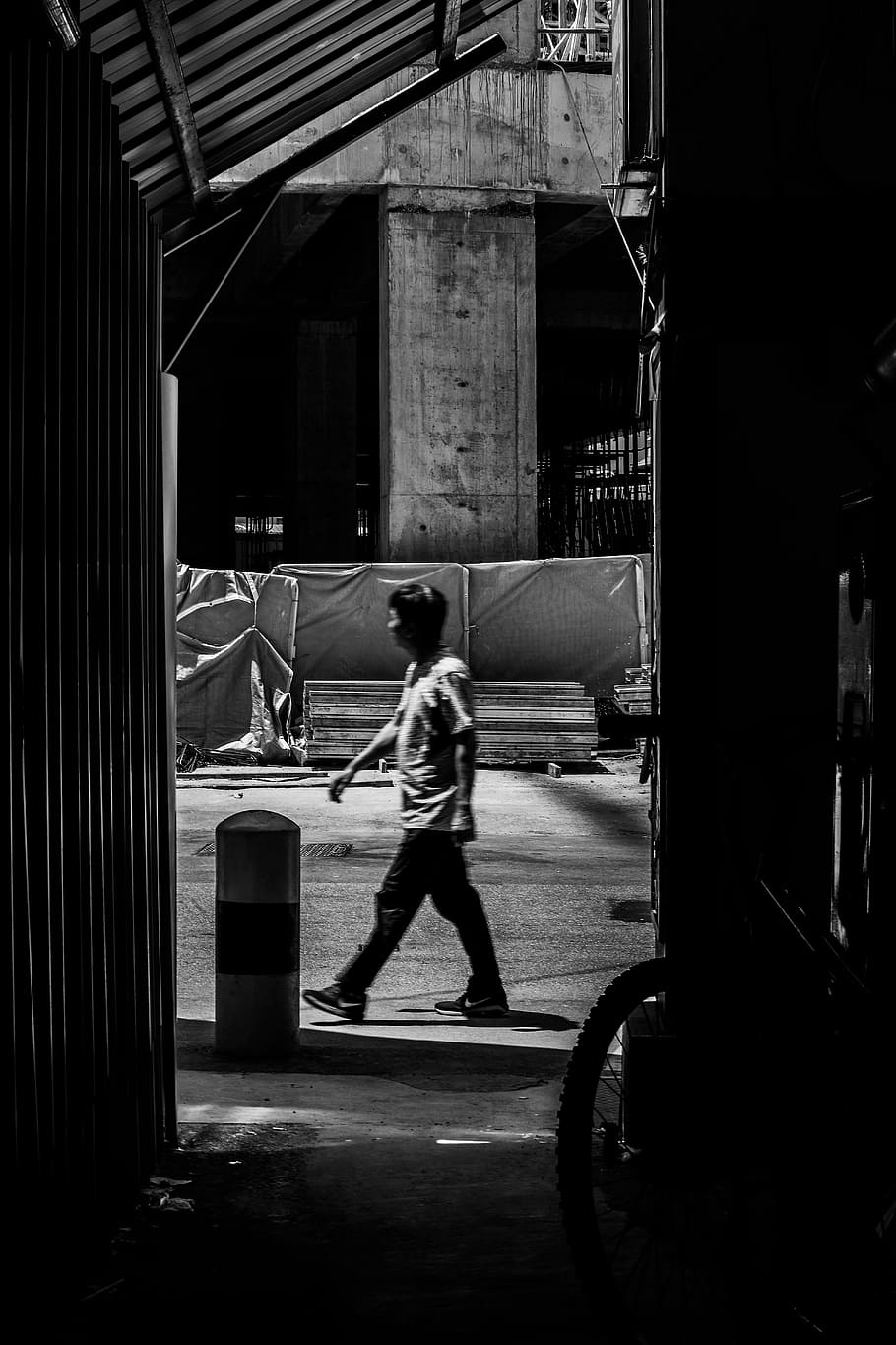 910x1365 HD wallpaper: grayscale photo of man walking on street, desktop wallpaper, iphone wallpaper