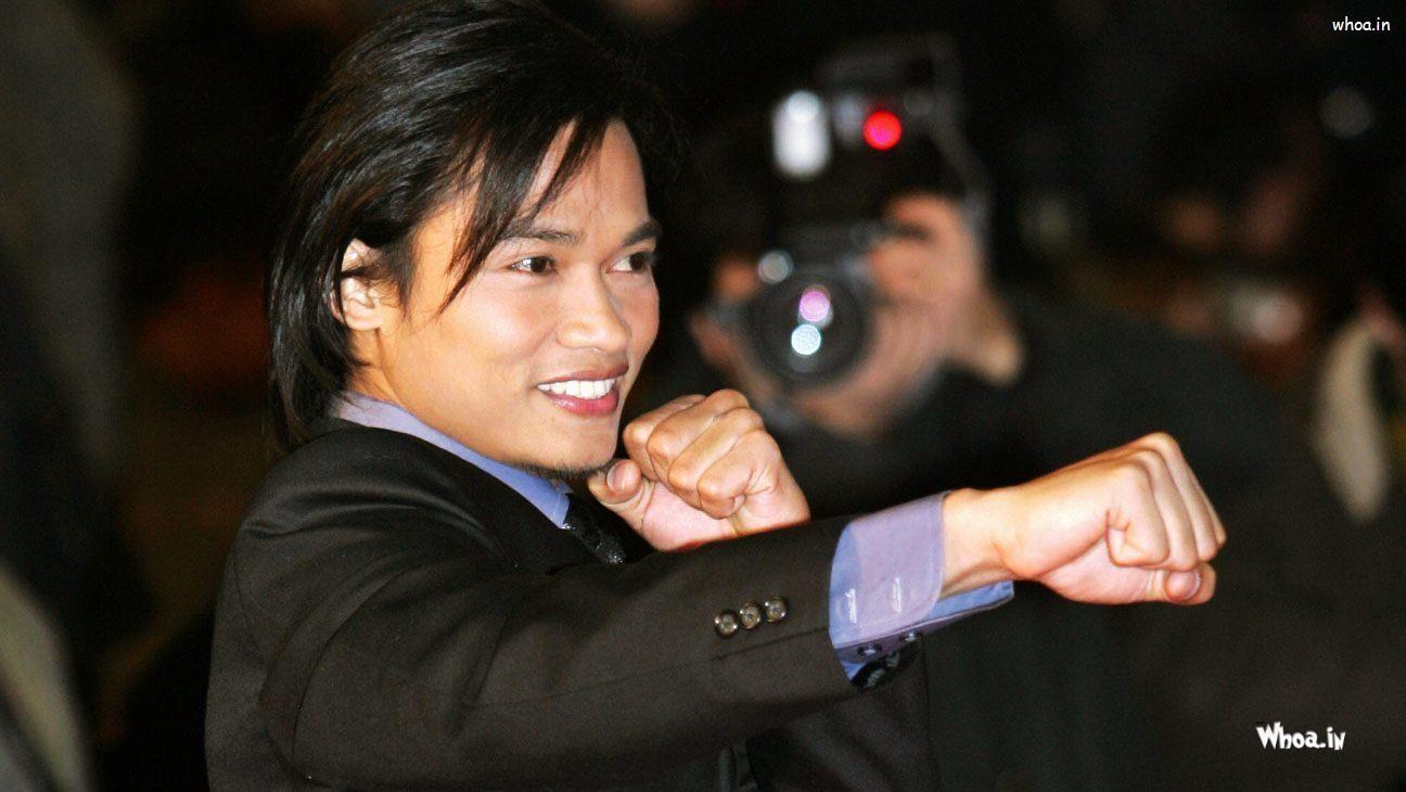 1296x730 Tony Jaa Black Suit And Stylish Hair Style Wallpaper