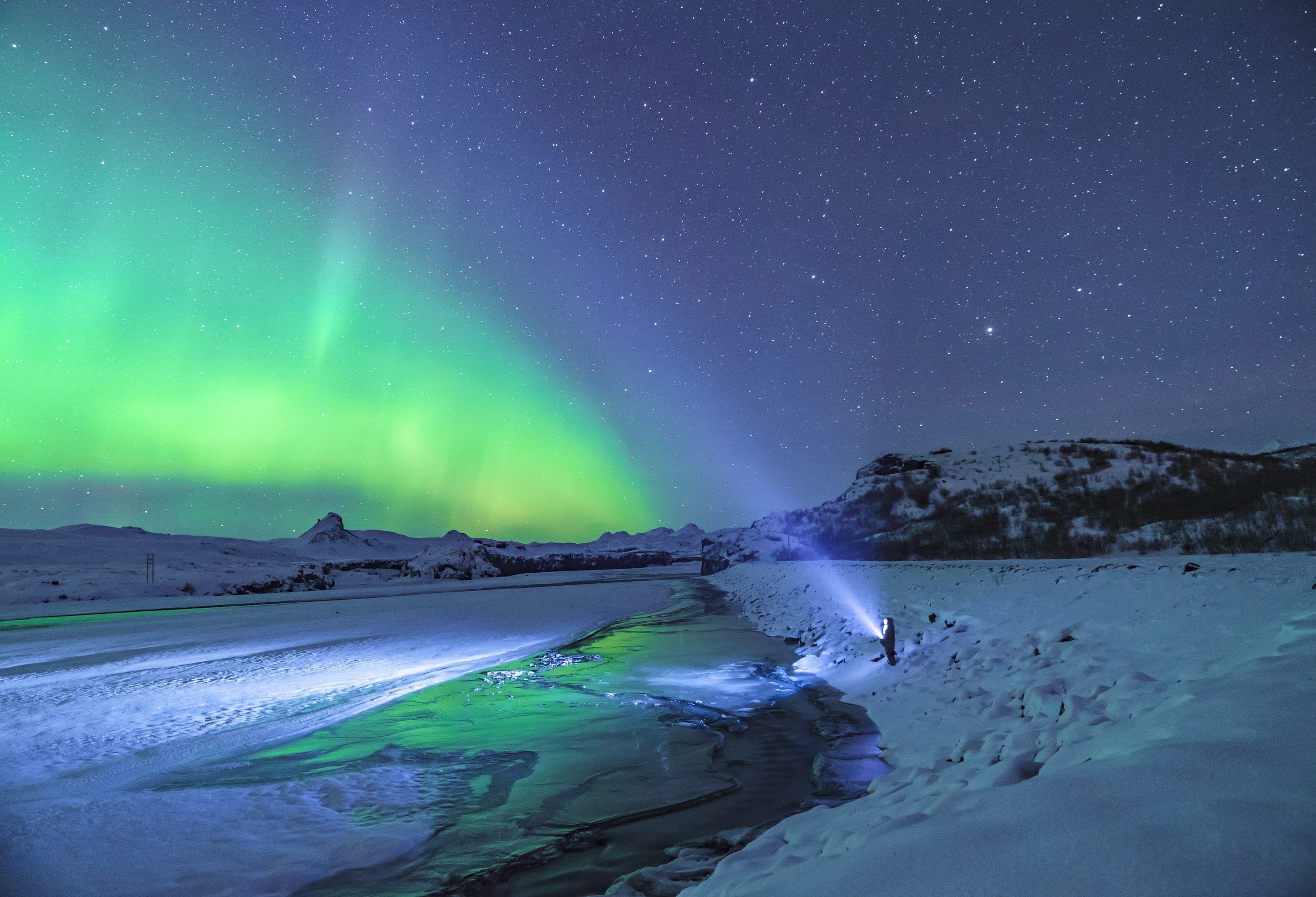3000x2044 Person standing under aurora lights photo