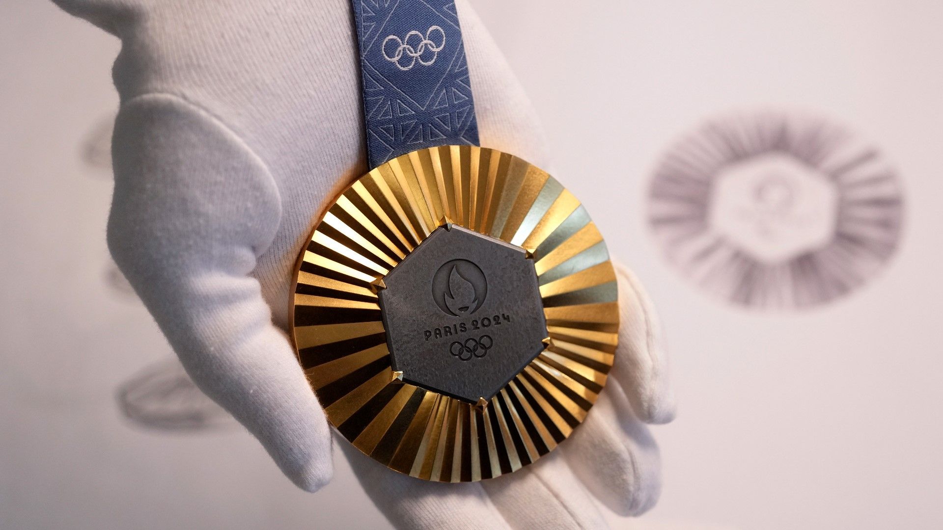 1920x1080 The Paris Olympics medals are monumental. They're embedded with pieces of the Eiffel Tower