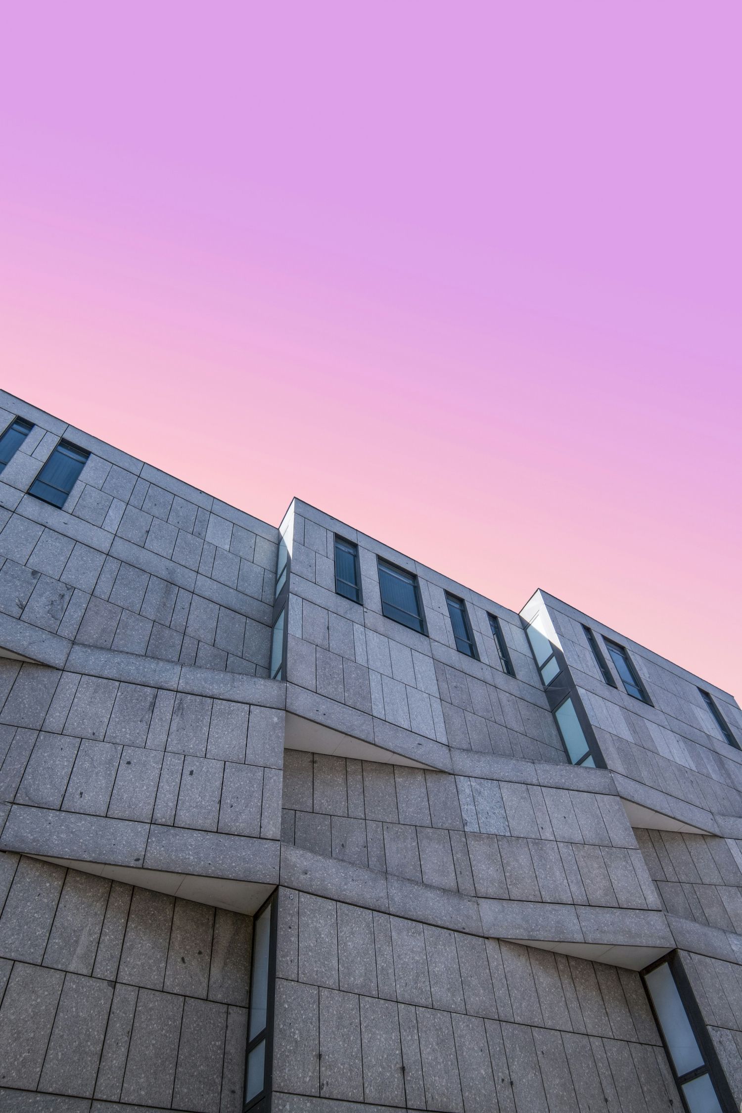1500x2250 Pink Sunrise Above Brutalist Concrete Architecture