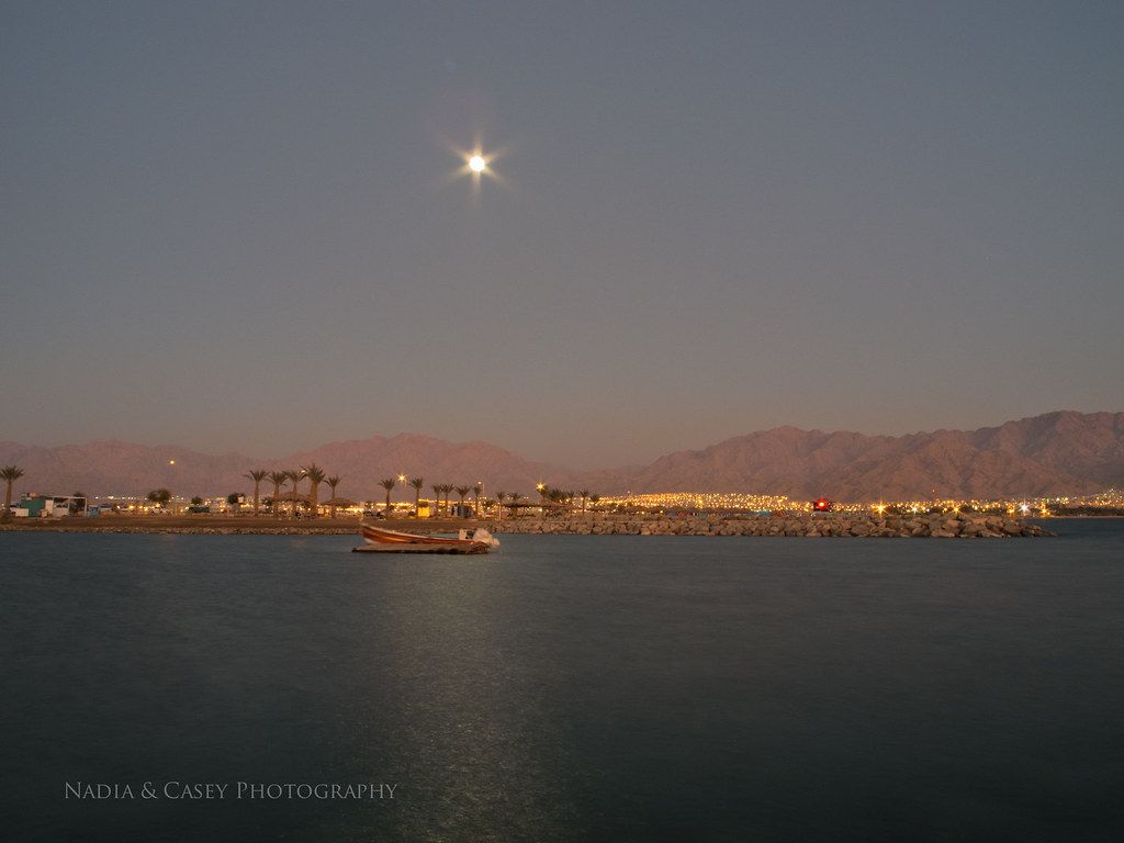 1024x768 Eilat Moon. Eilat, Israel A boat sits in the moon light nex