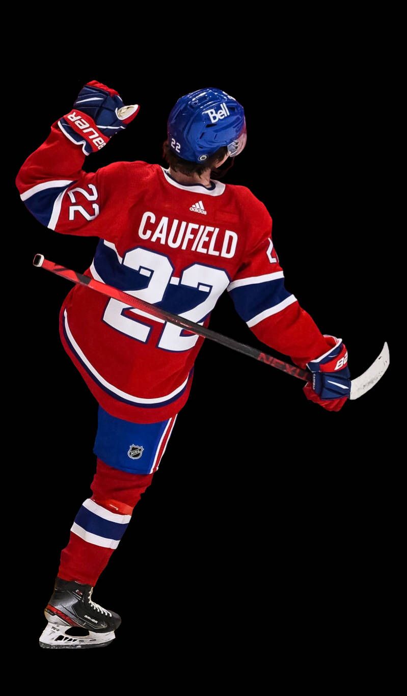 799x1366 Download Cole Caufield Hitting Goal Pose Wallpaper