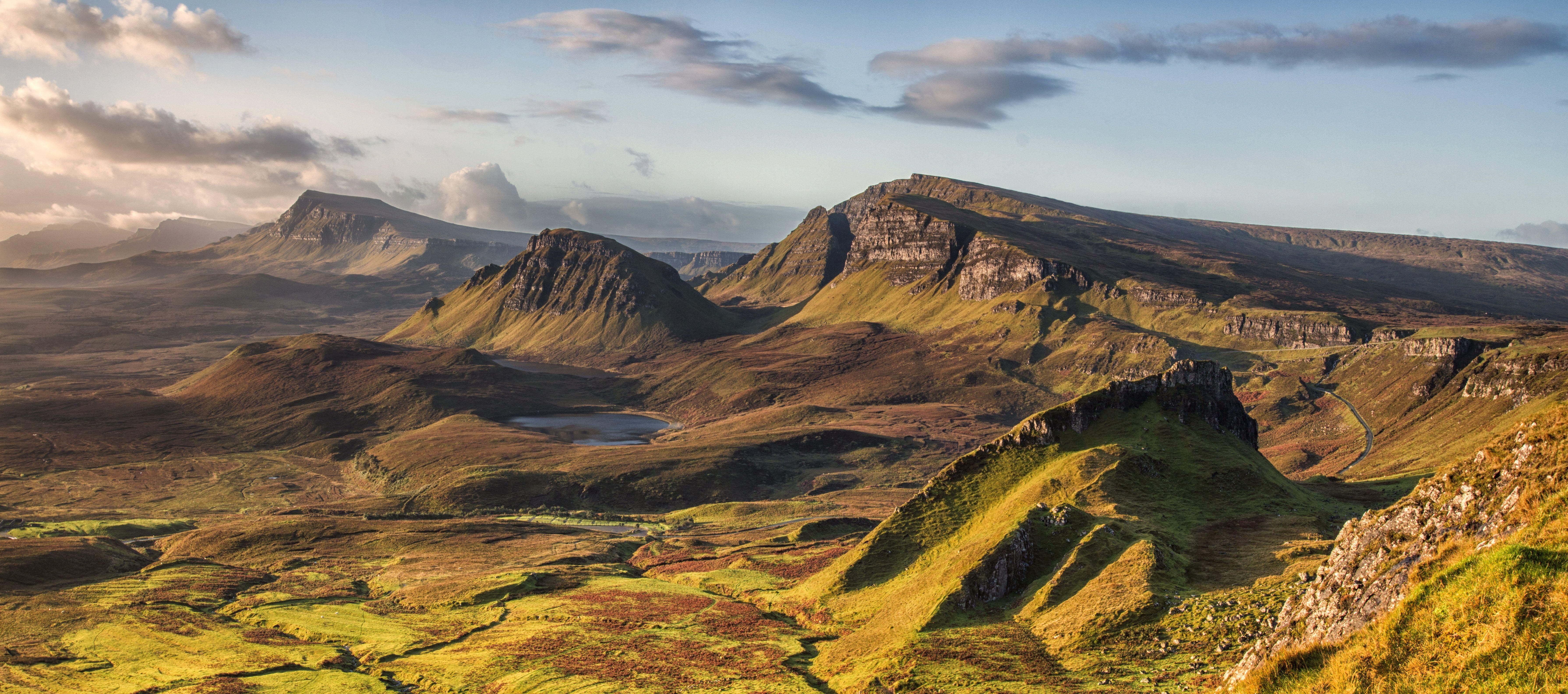 7160x3169 Landscape photo of rocky mountains under cloudy sky, quiraing