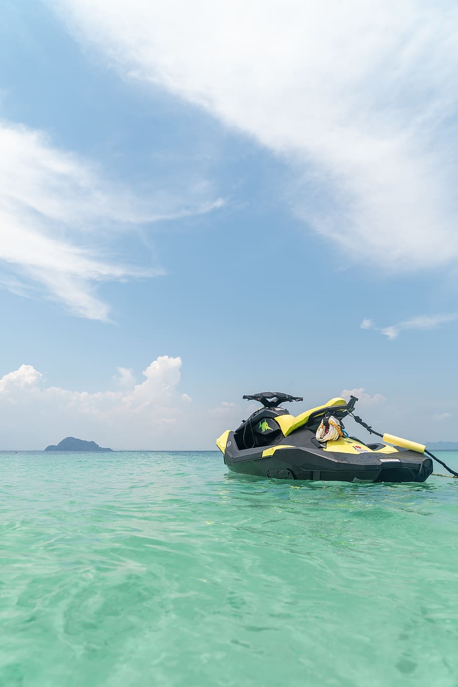 910x1365 HD wallpaper: Empty Yellow and Black Jet Ski in Teal Sea Water