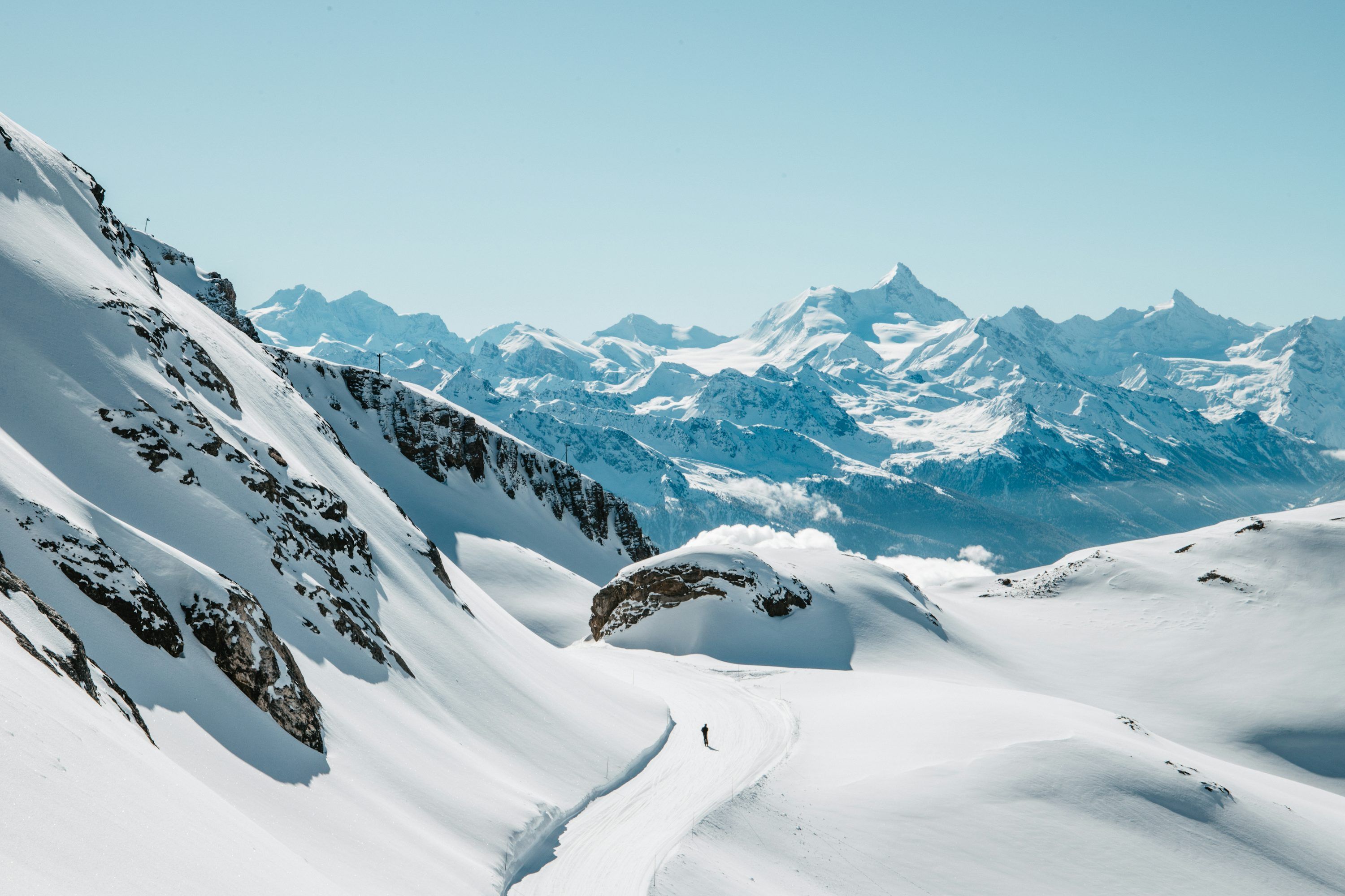 3000x2000 Snow Covered Mountains Under A Clear, Bright Sky. Photo