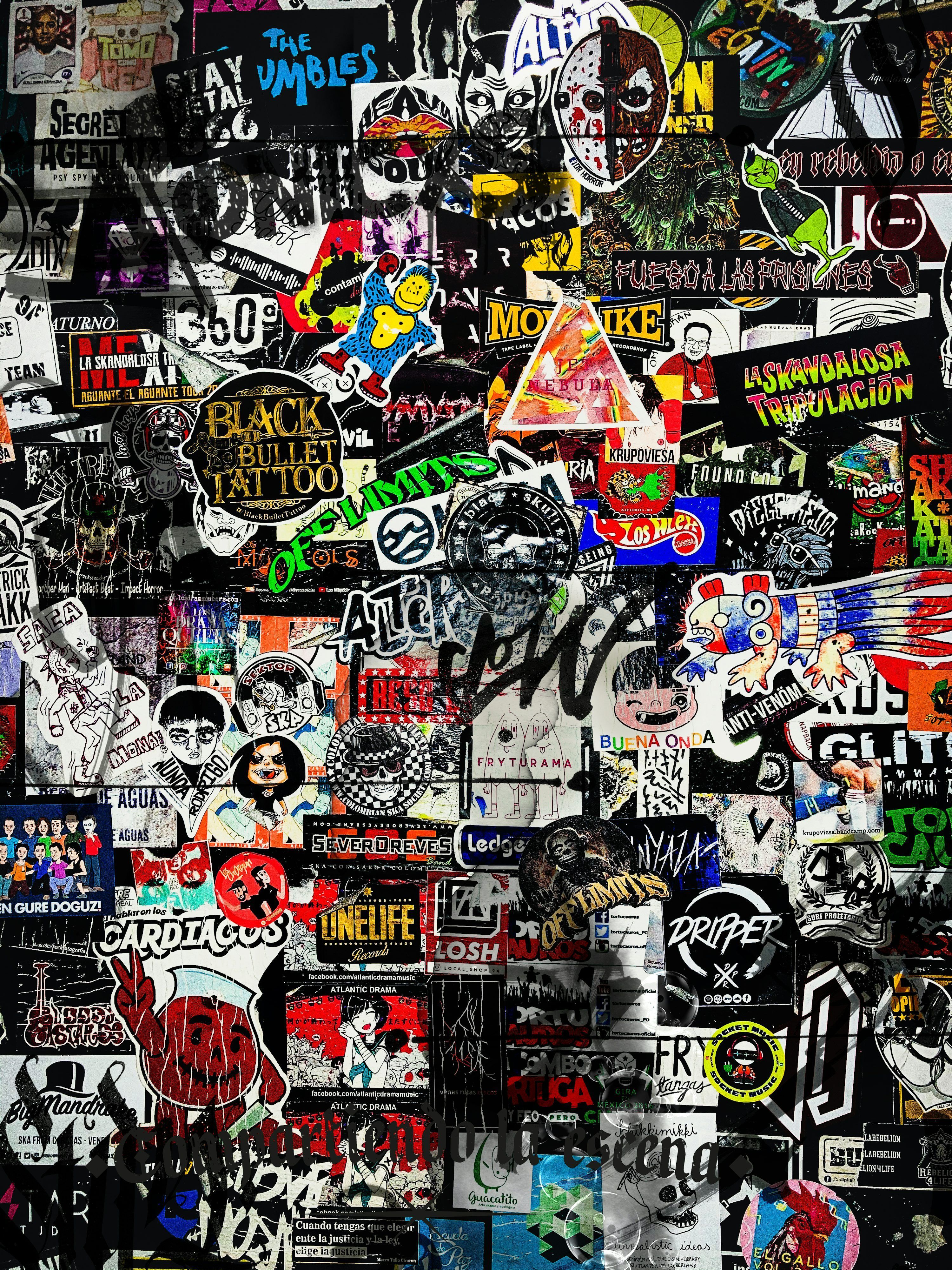 3000x4000 A wall covered in lots of different stickers photo