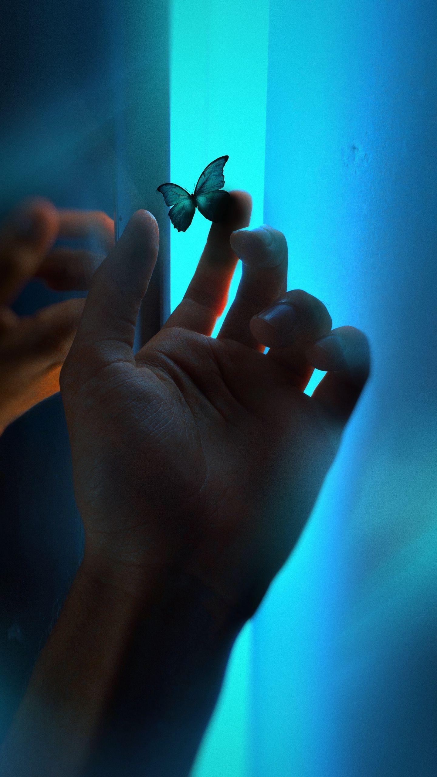 1440x2560 Download wallpaper 1440x2560 hand, butterfly, neon, fingers, glow