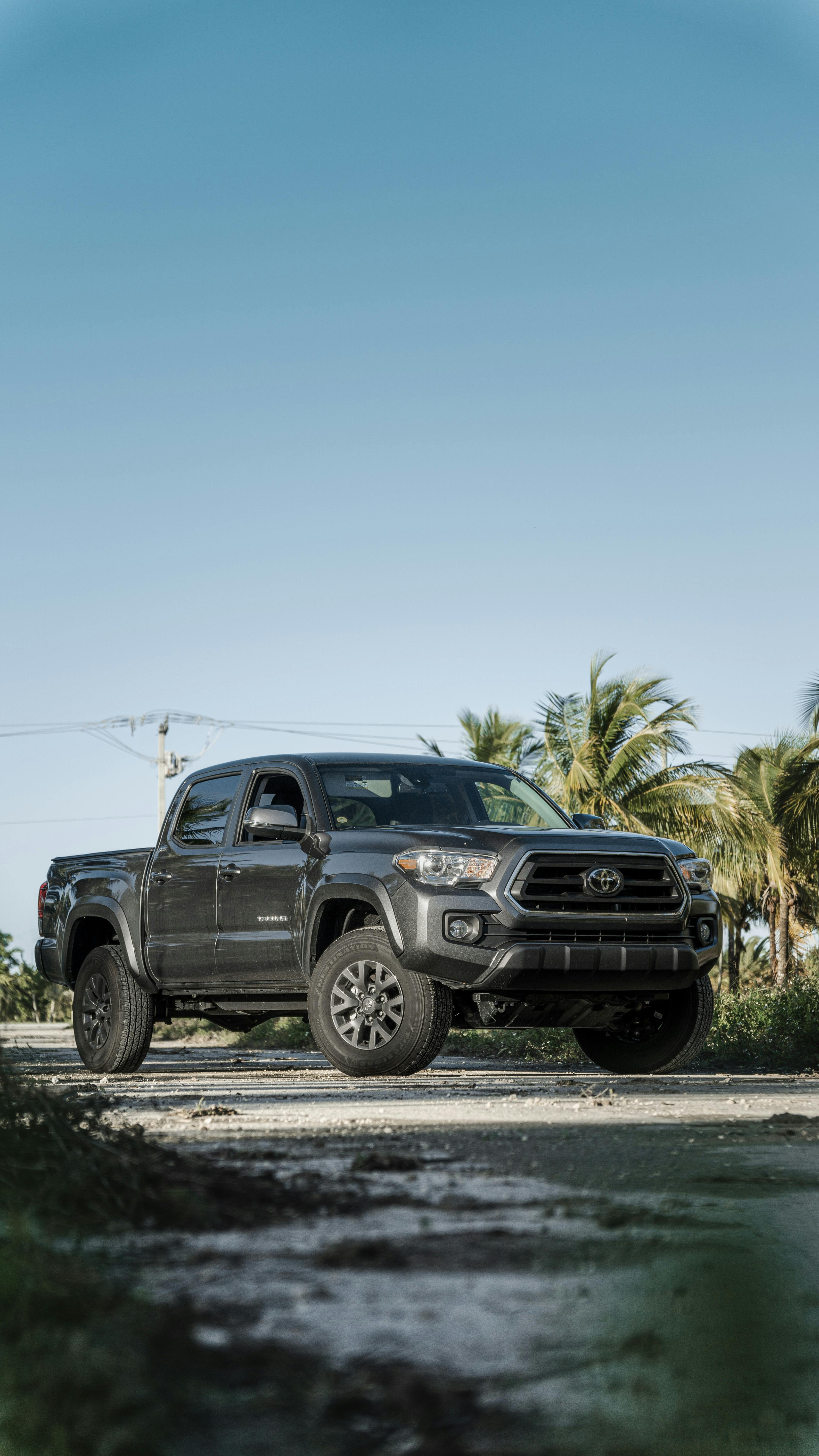 3376x6000 A Black 2021 Toyota Tacoma on the Road under Blue Sky · Free