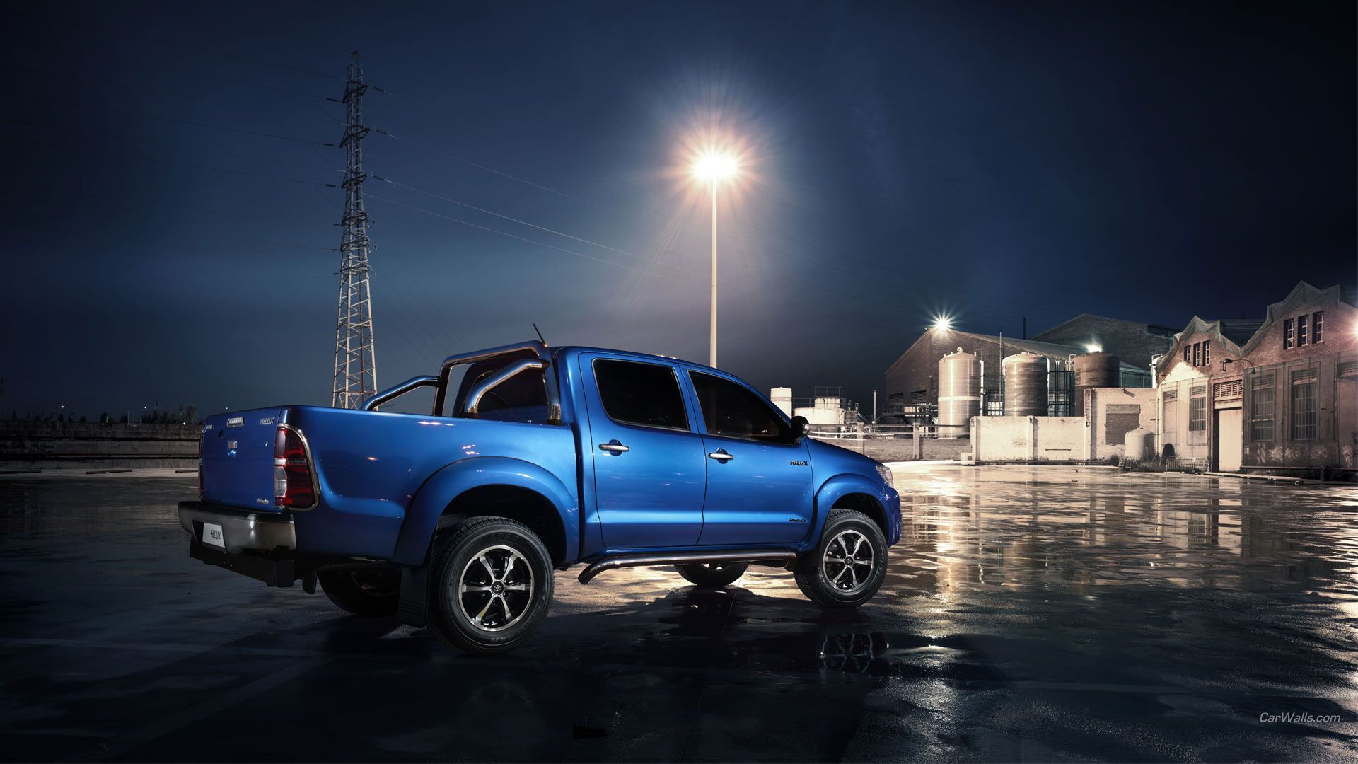 1920x1080 Toyota Hilux HD Wallpaper: Rugged Power Meets Nighttime Cityscape