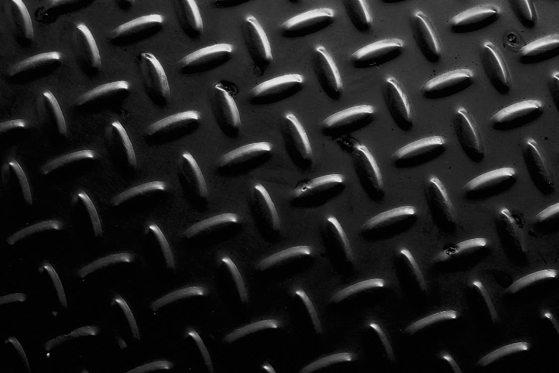 1125x750 Textured background of metal floor with symmetrical oval bulges · Free