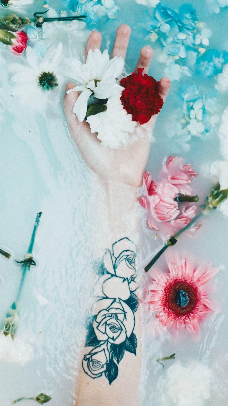 938x1668 Download wallpaper 938x1668 hand, tattoo, flowers, water iphone 8
