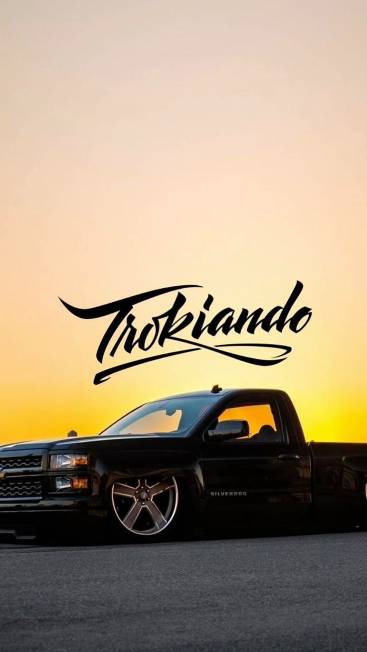 736x1308 Black Truck Parked in Front of a Sunset