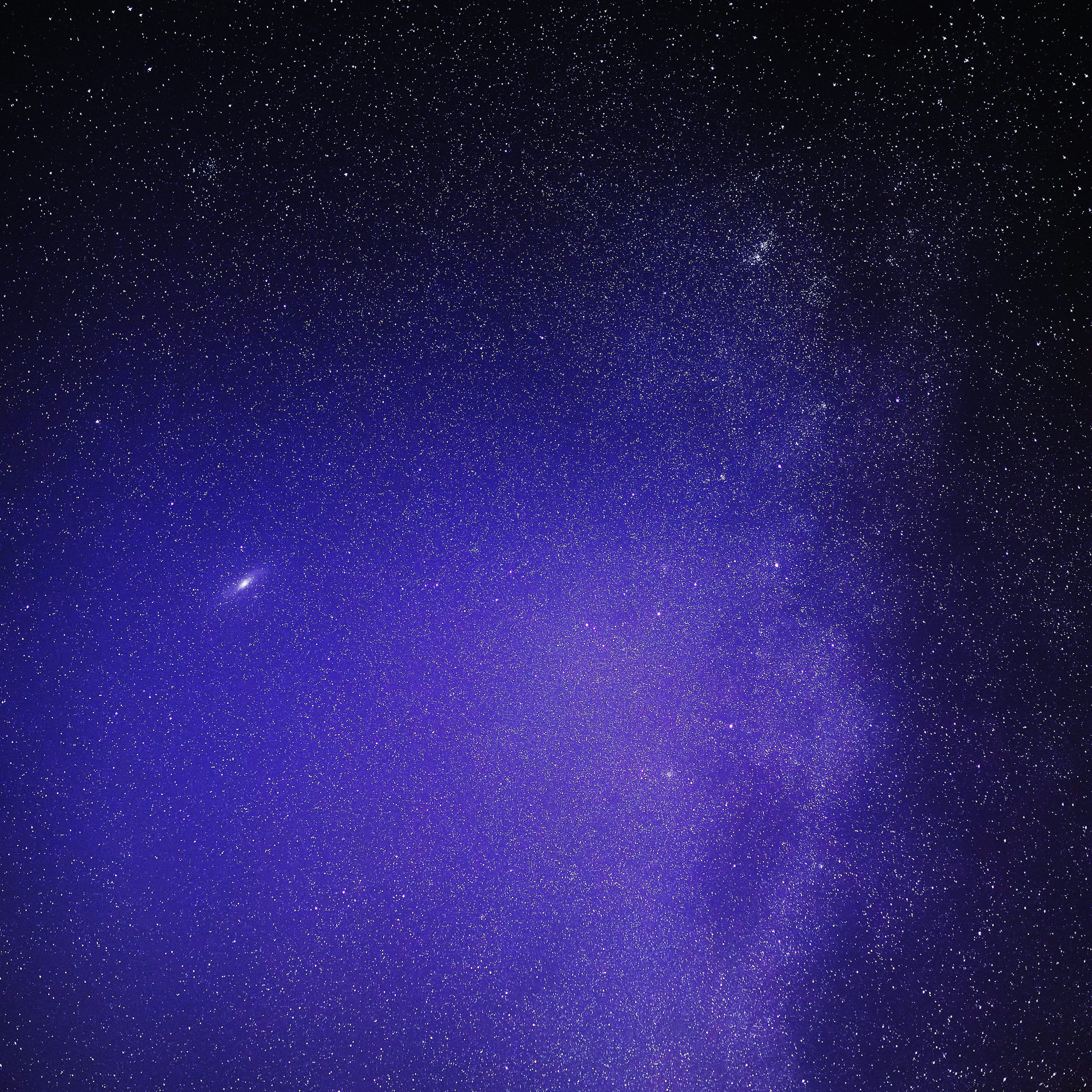 3000x3000 A night sky with stars and a bright purple light photo