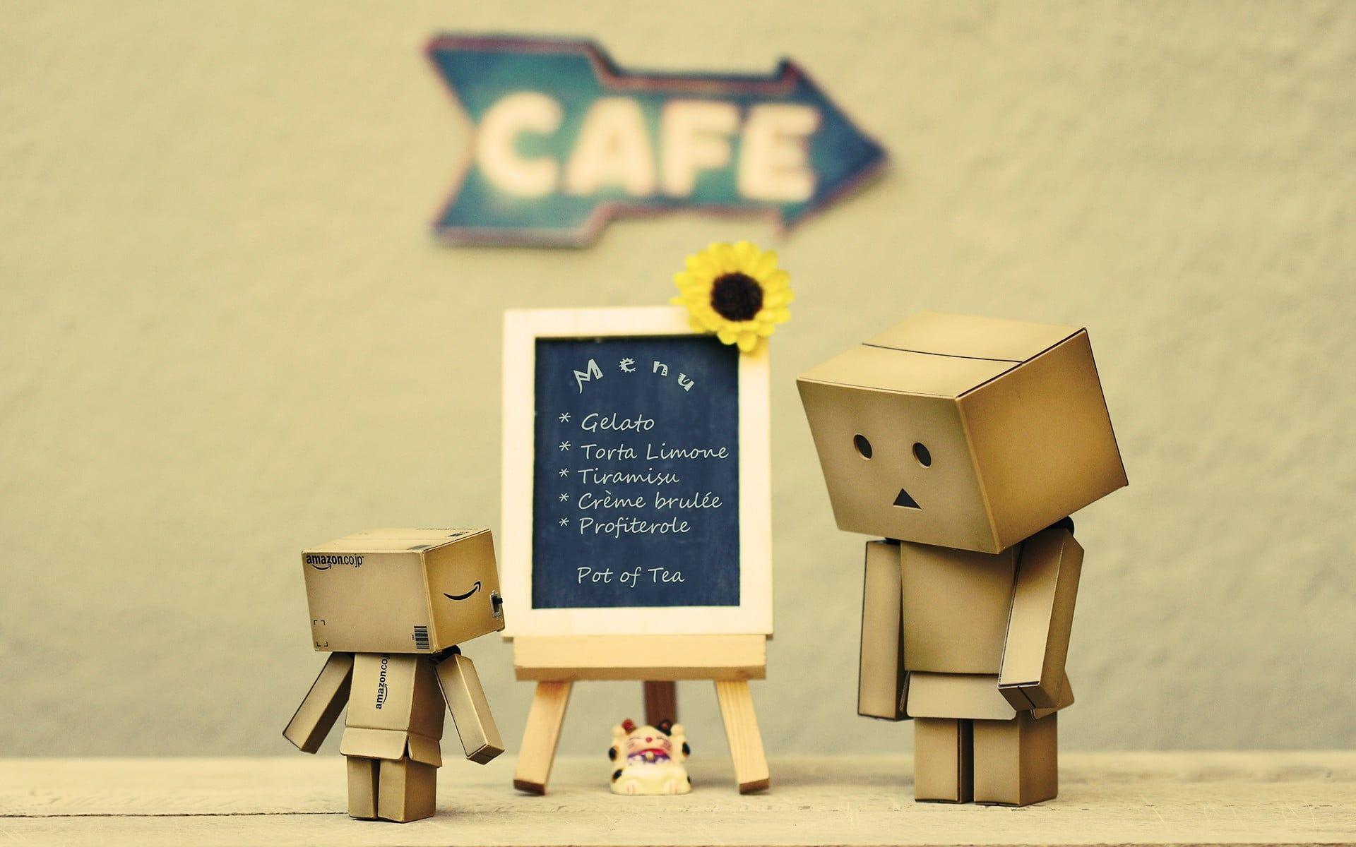 1920x1200 Two cardboard robots beside easel digital wallpaper HD wallpaper